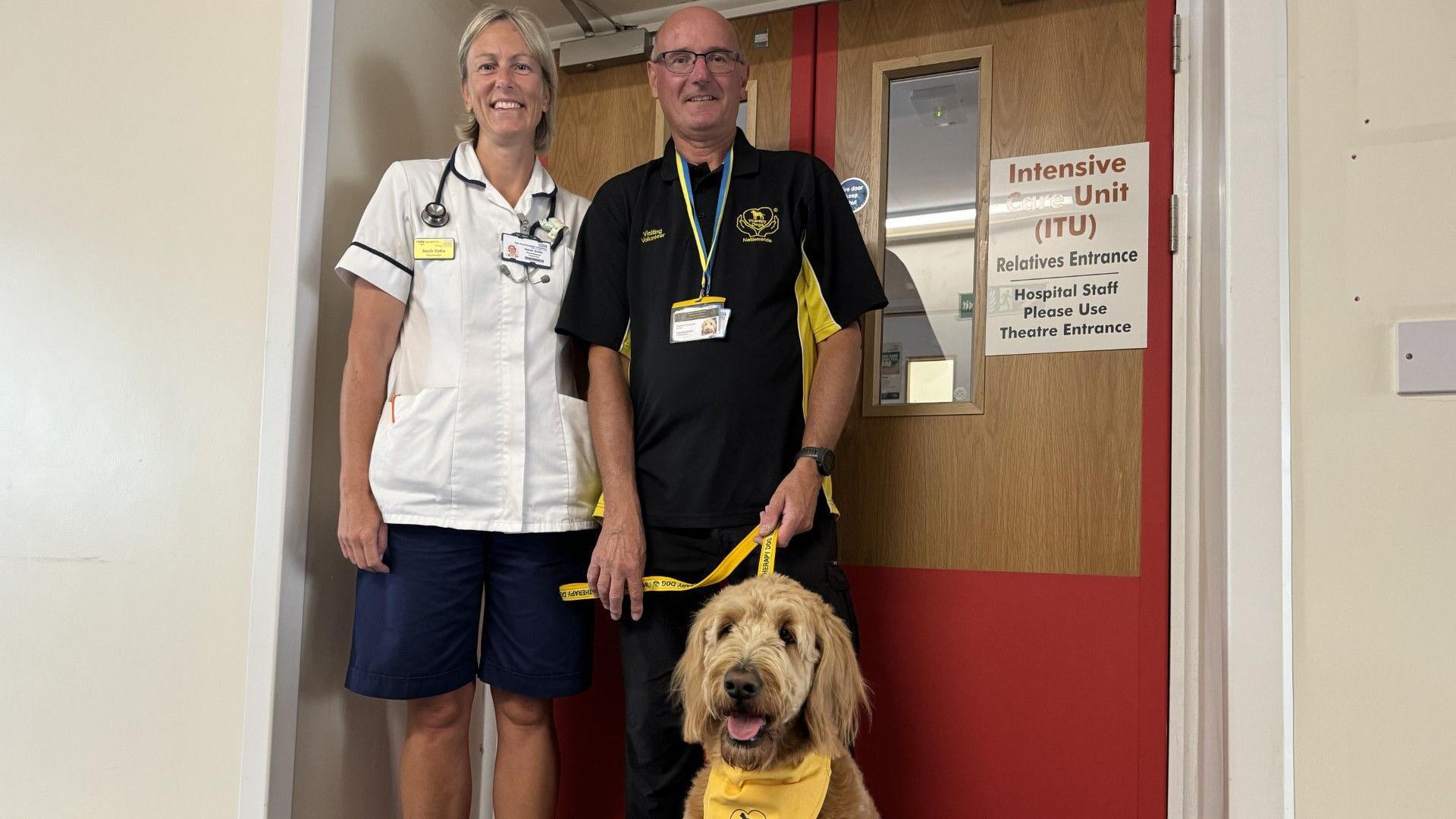 Mr Avery, Martha and another nurse standing by a door marked as Intensive Care