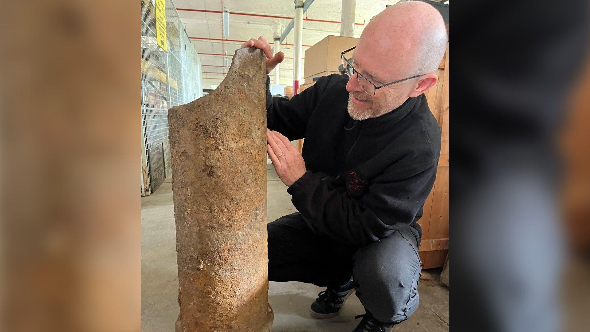 John McGoldrick, Leeds Museums and Galleries’ curator, with one of the finds from the dig