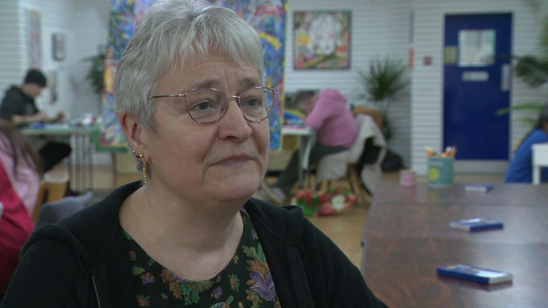 Fiona Wilson, the vice chair of the economy and growth committee at Cheshire East Council - she has short hair and wears glasses, with a black jacket and a floral print top