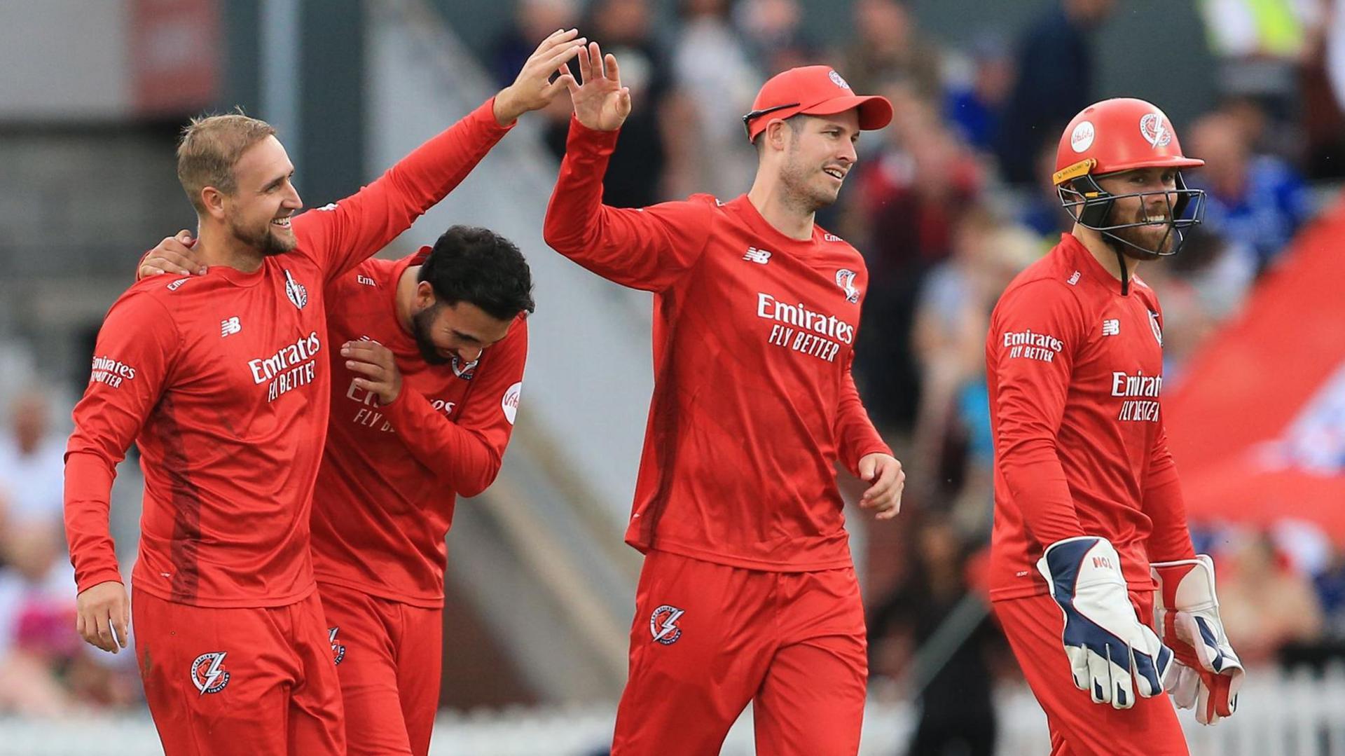 Lancashire players celebrate a wicket