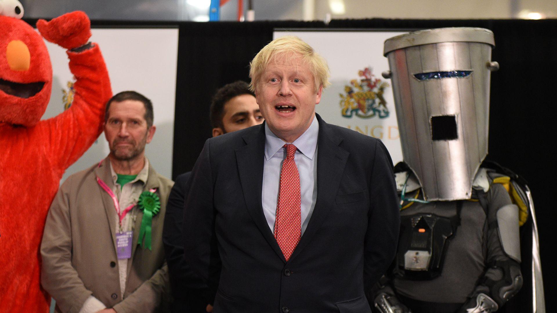 Then-prime minister Boris Johnson winning the 2019 election as the MP for Uxbridge with Count Binface and Bobby "Elmo" Smith behind him