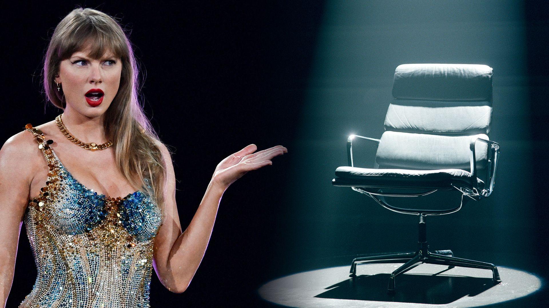 Taylor Swift stood next to a black chair with a spotlight shining on it 