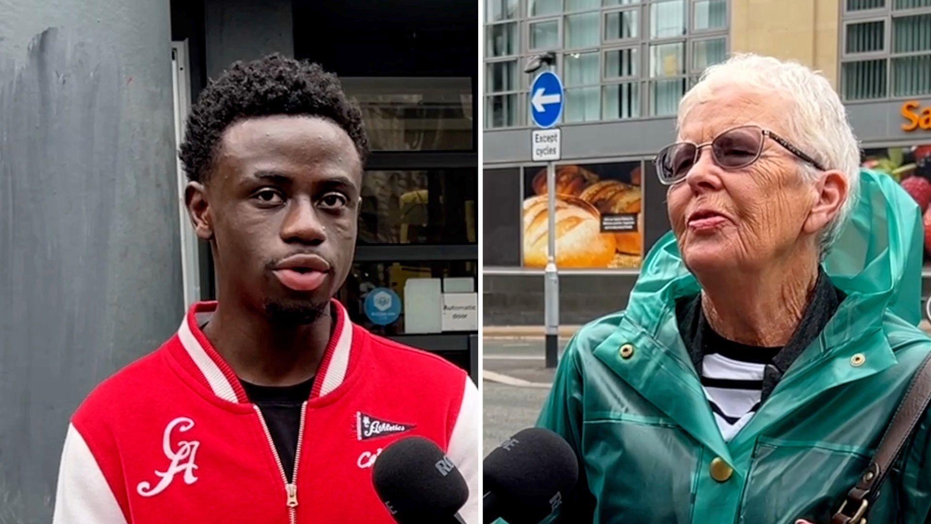 A young man in a red jacket and an elderly woman in a green coat speak on a street
