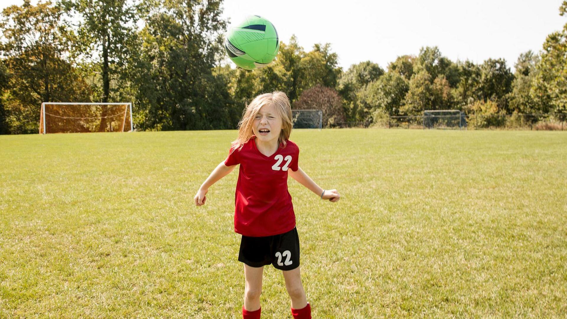 Girl heads football.