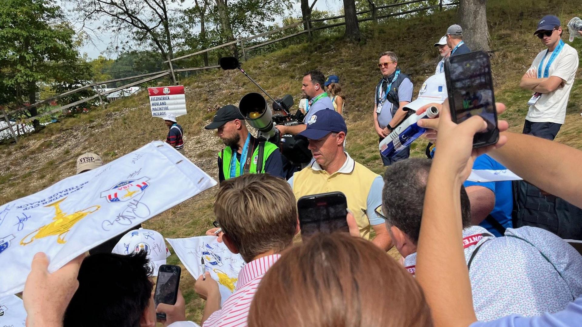 Rory McIlroy signs autographs