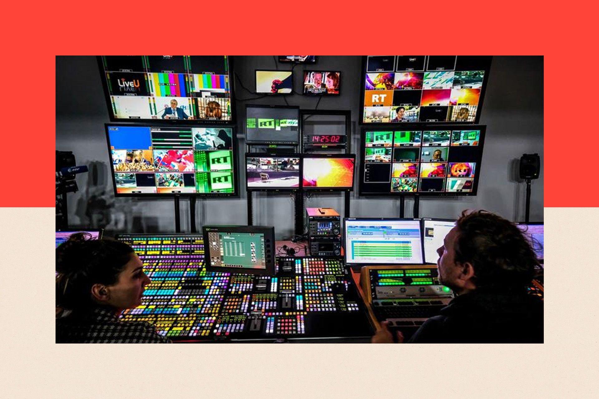 A picture taken on June 8, 2018 shows an unidentified directors of the Russia Today (RT) TV company at in their apparatus room in Moscow