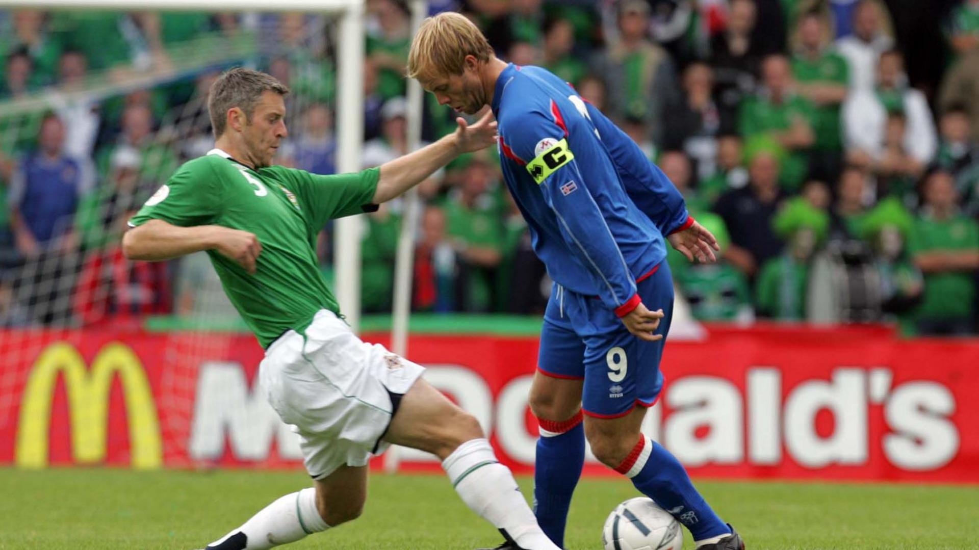 Stephen Craigan tackles Eidur Gudjohnsen