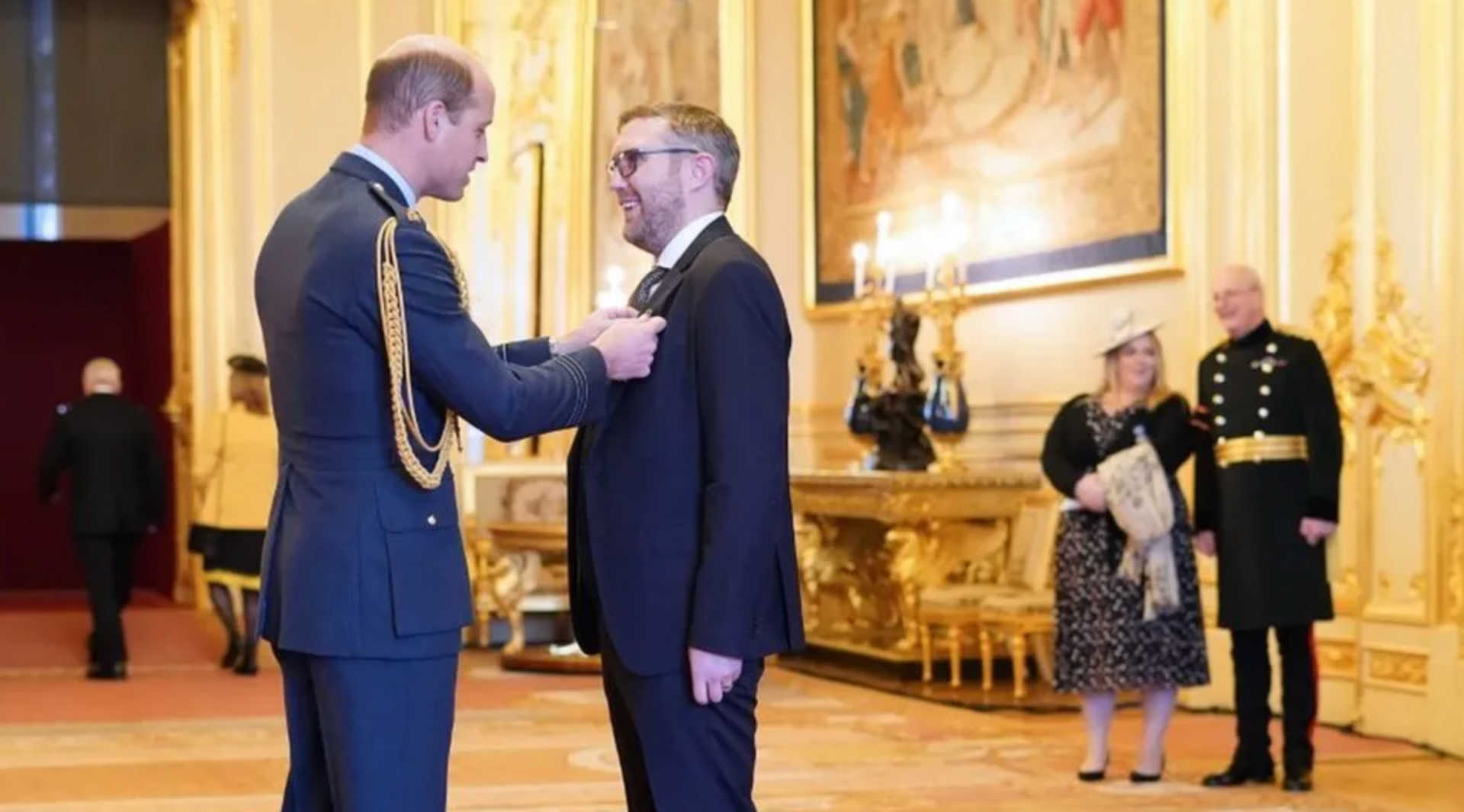 Jay Flynn receiving an MBE from Prince William