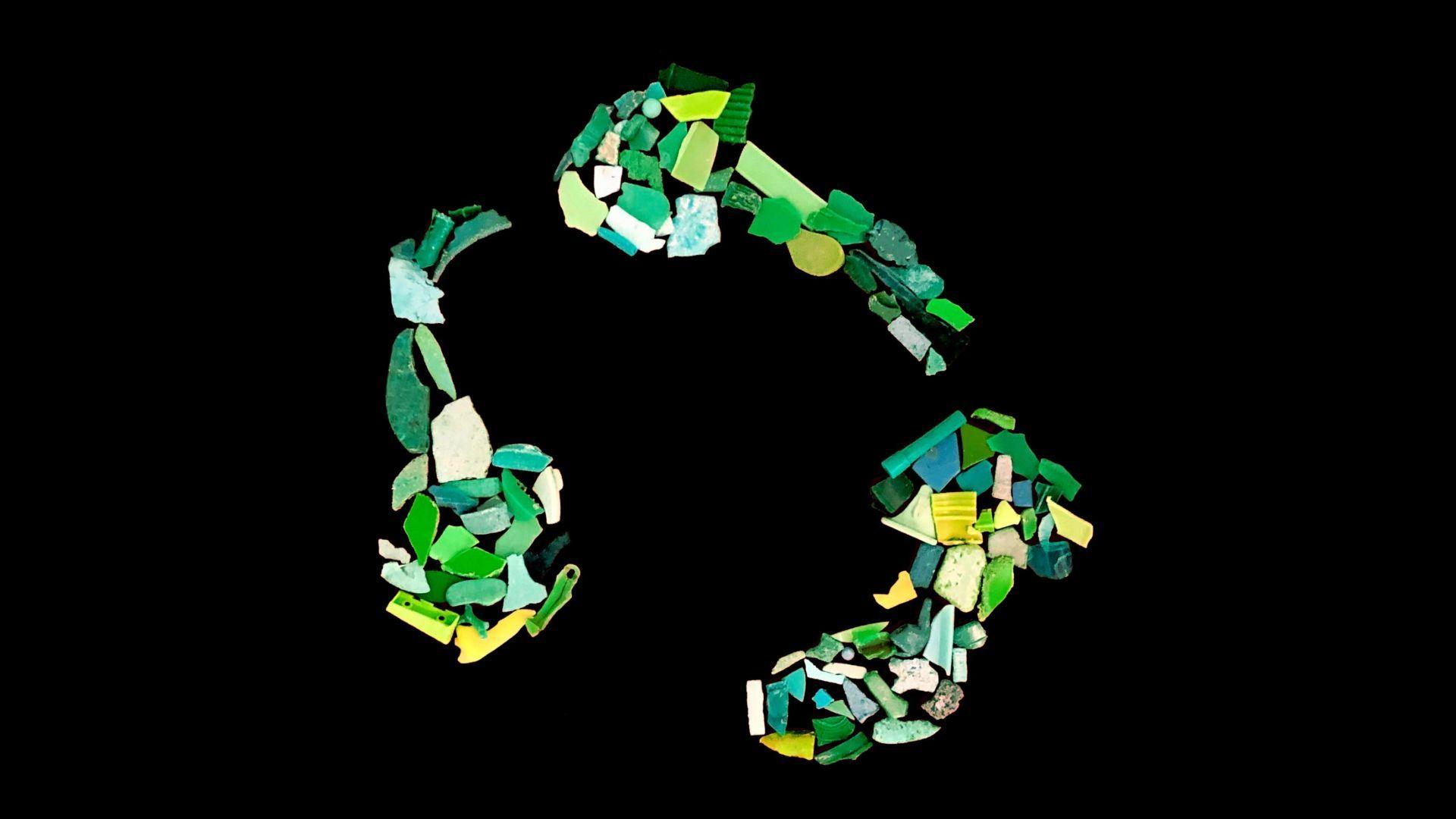 Green plastic squares and shapes appear in three sections and placed in a circular shape with gaps between each grouping