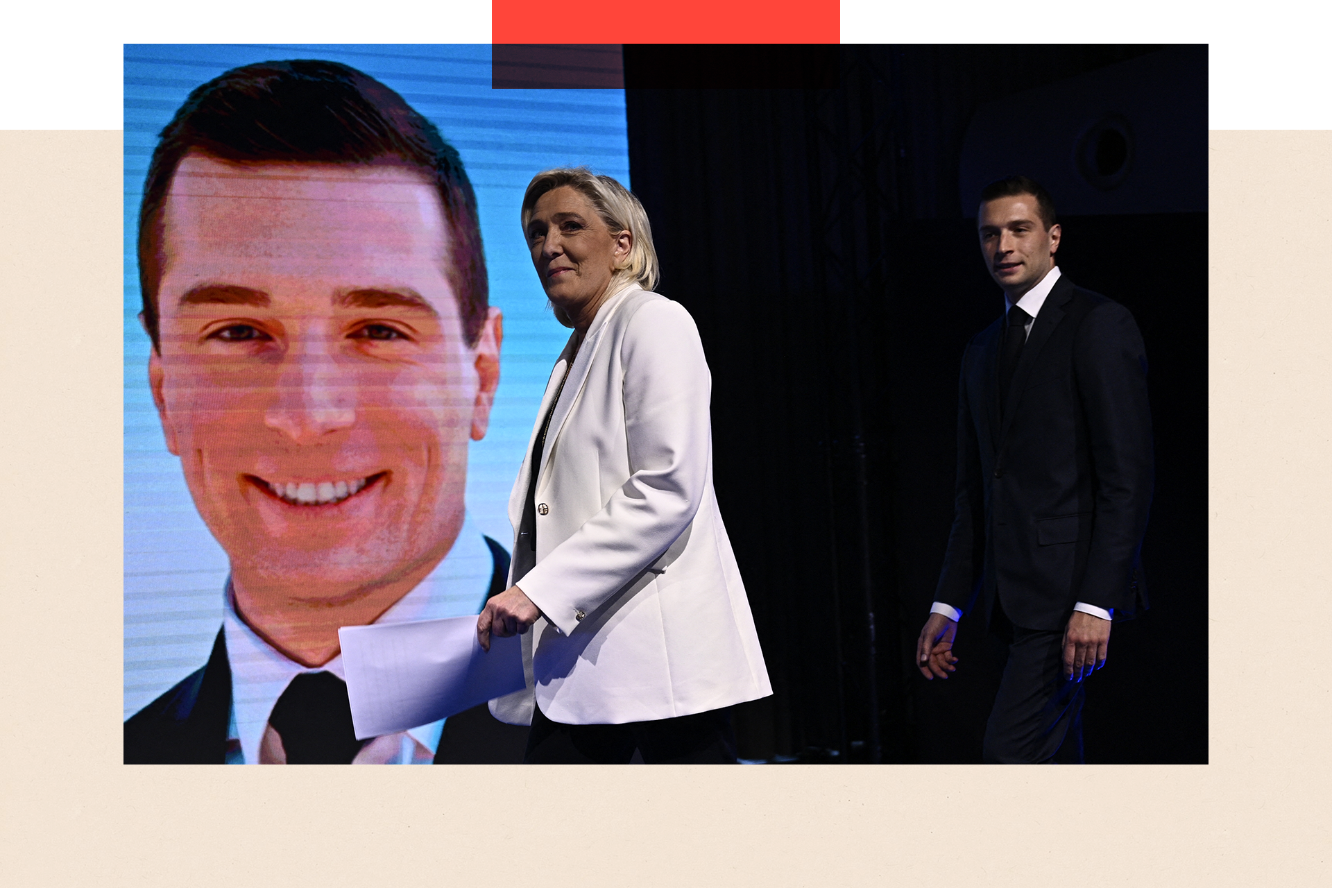 Marine Le Pen and Jordan Bardella walk on stage