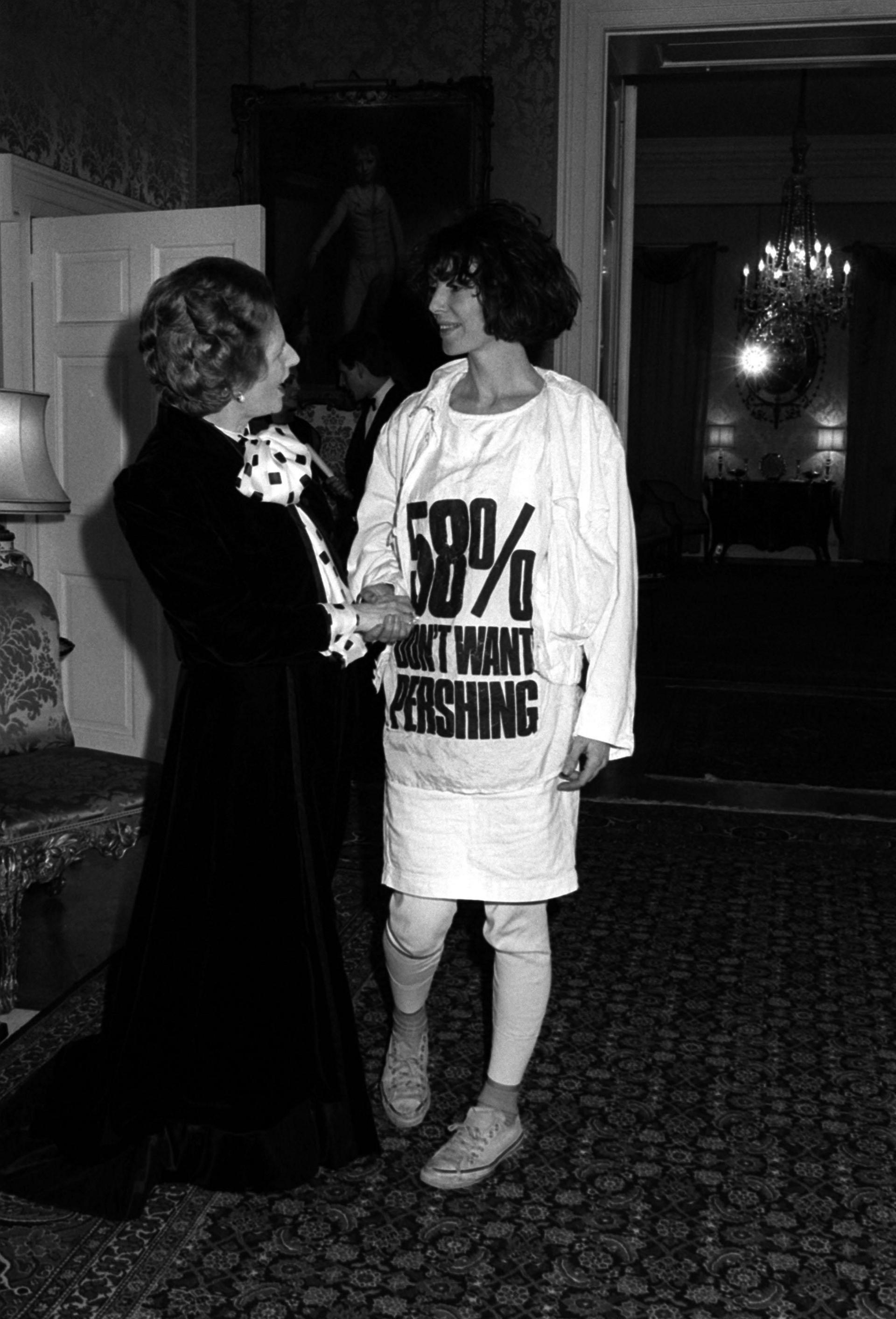 Prime Minister Margaret Thatcher greets fashion designer Katharine Hamnett