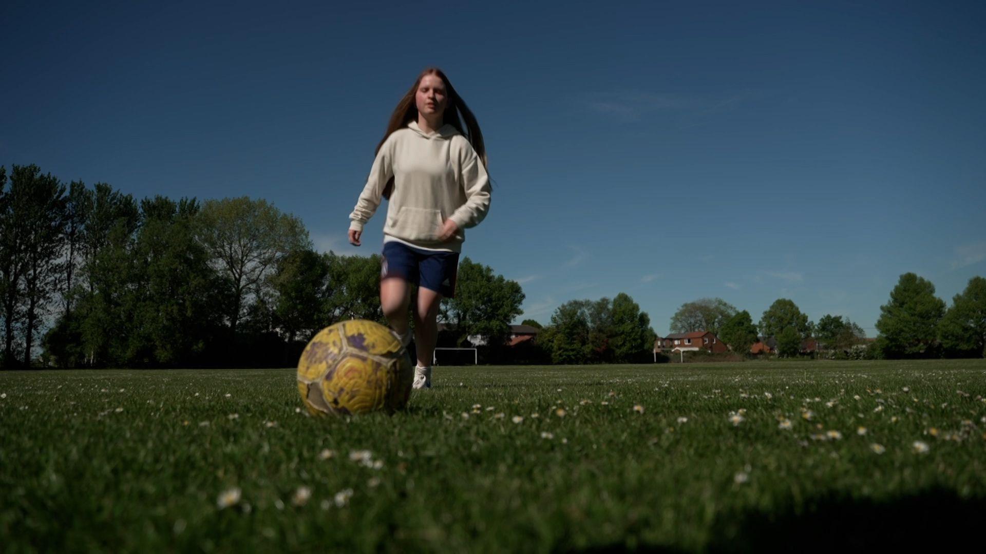 Cerys Vaughan playing football