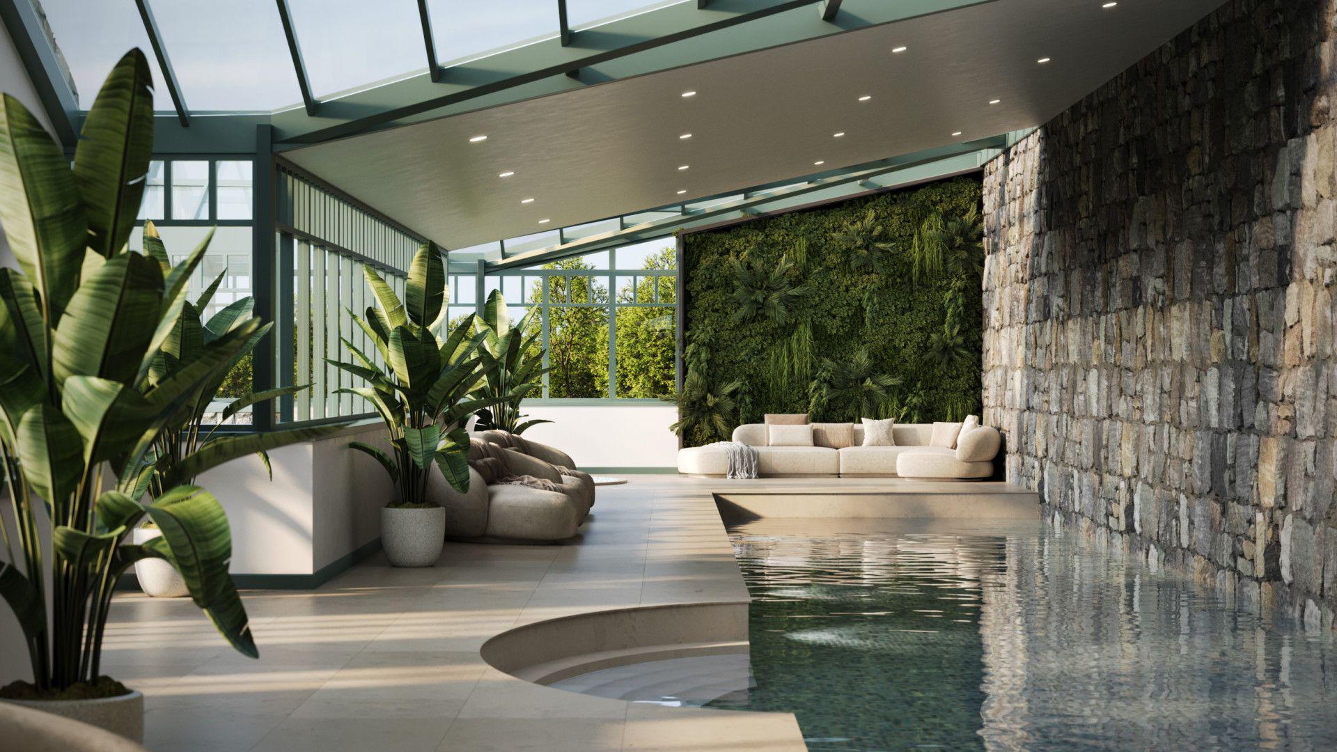 An indoor pool within an glass-roofed section of the property.
