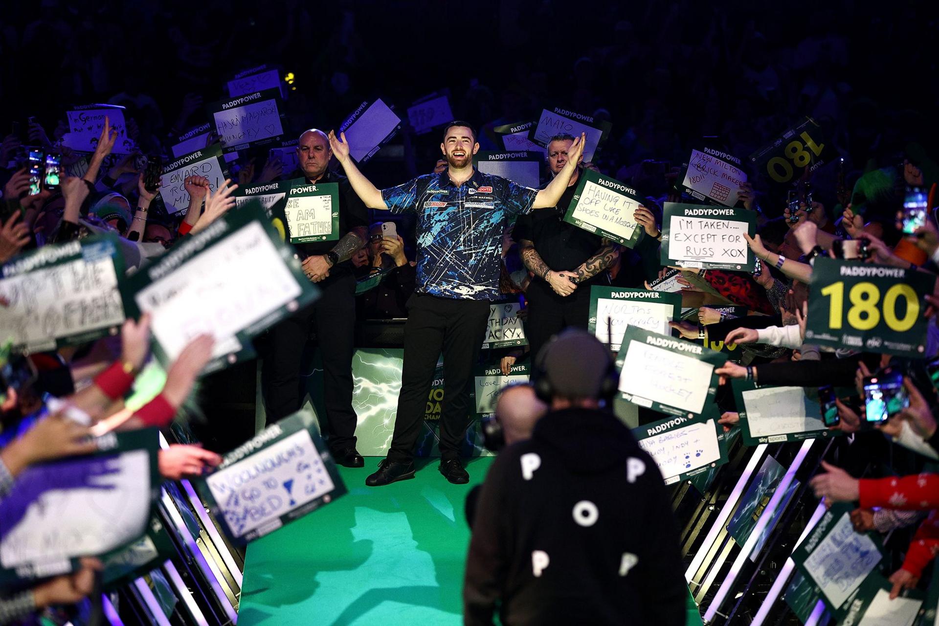 Luke Humphries of England acknowledges the fans as he walks in prior to his second round match against Thibault Tricole of France during day one of the 2024/25 Paddy Power World Darts Championships at Alexandra Palace.