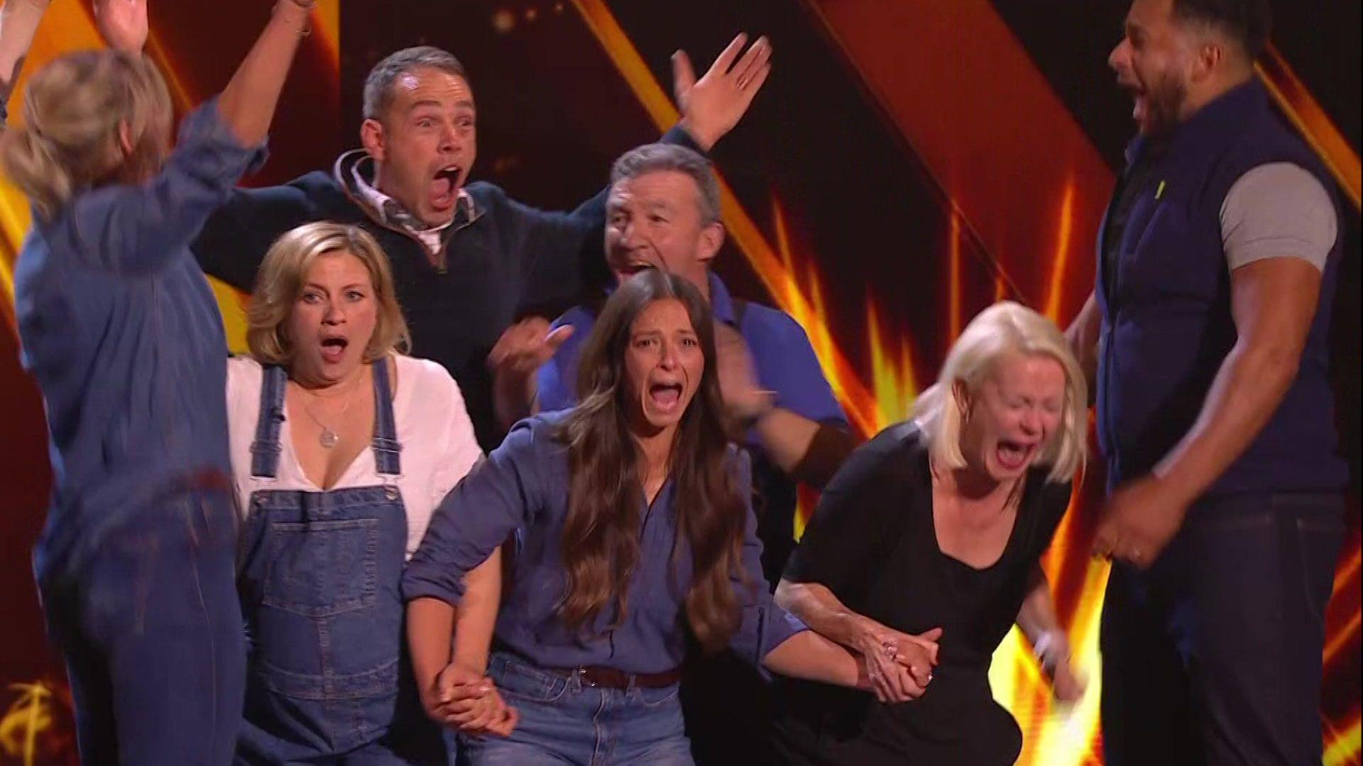  The choir on stage celebrating their win