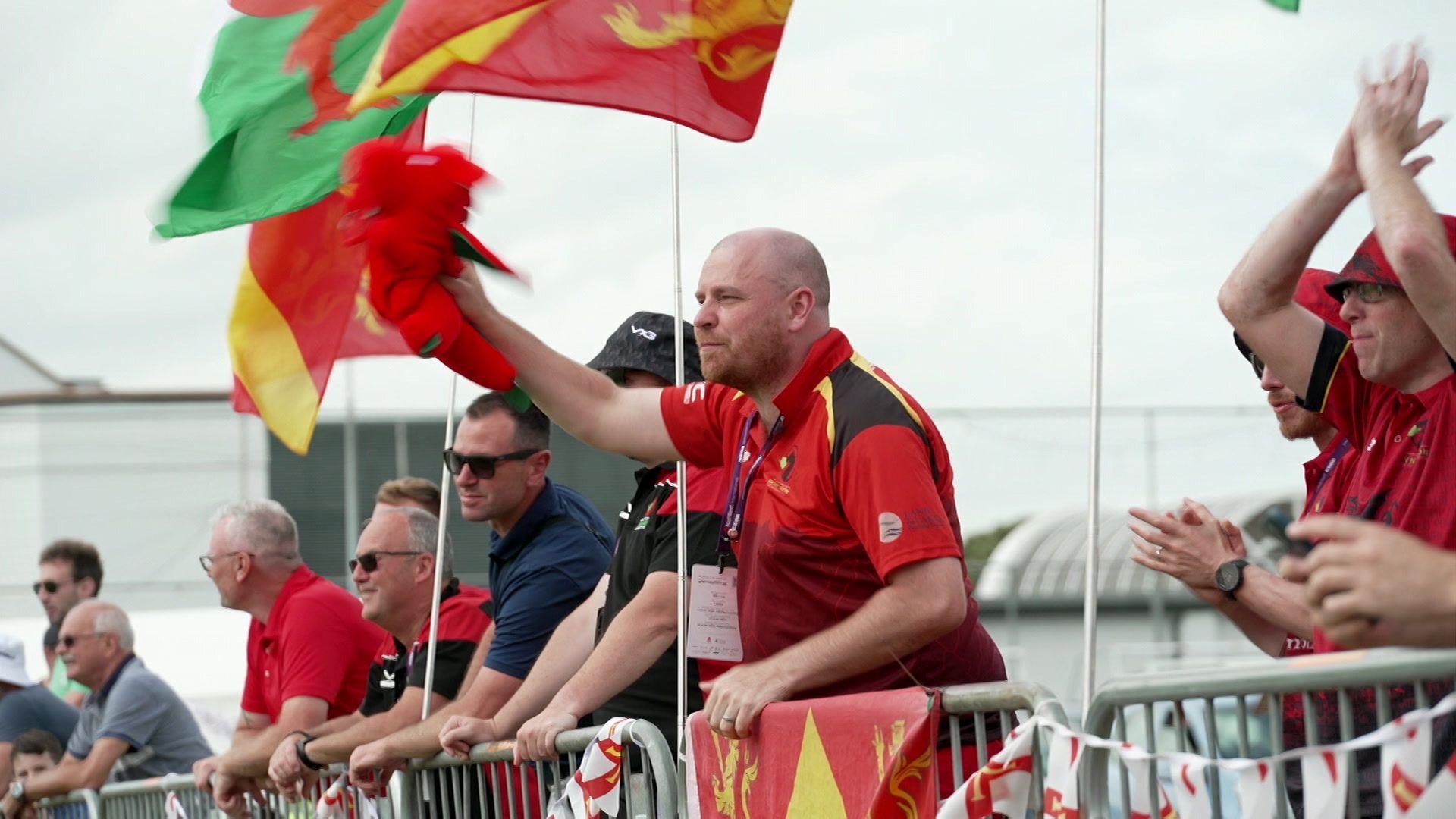 Pete Millar in Welsh and Ynys Mon gear cheering the team on