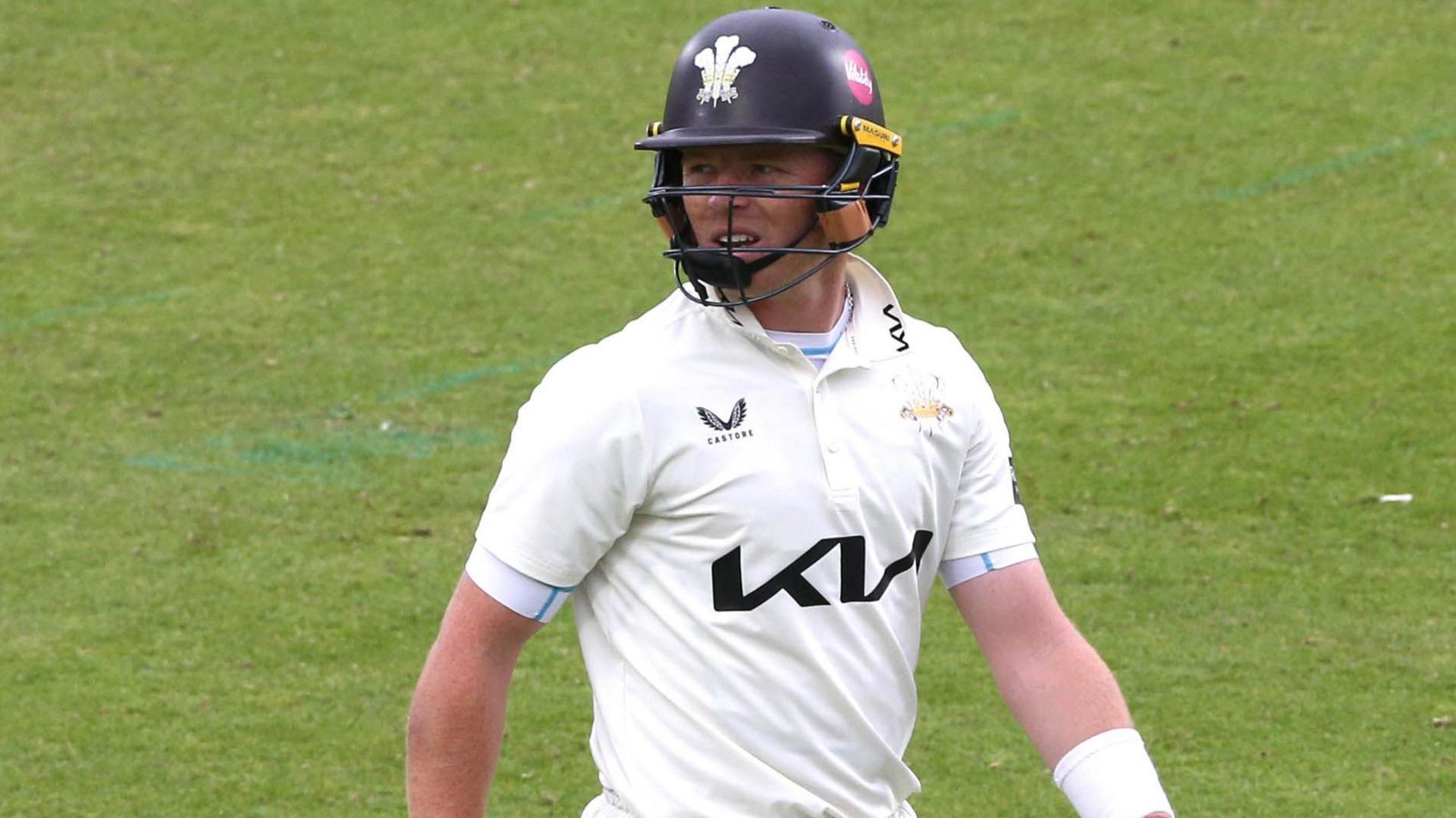Ollie Pope walks off the field