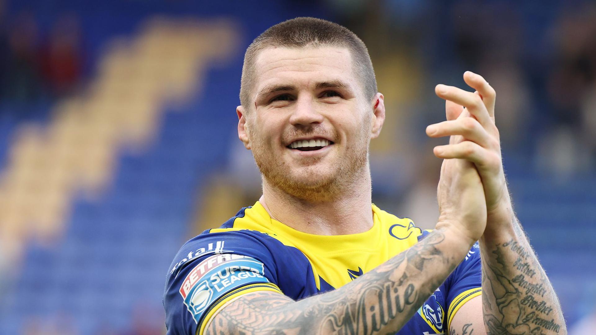 John Bateman applauds the crowd during his time with Warrington Wolves in 2024