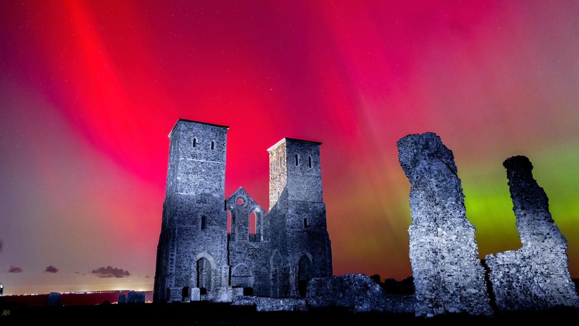 A castle with bright red in the background