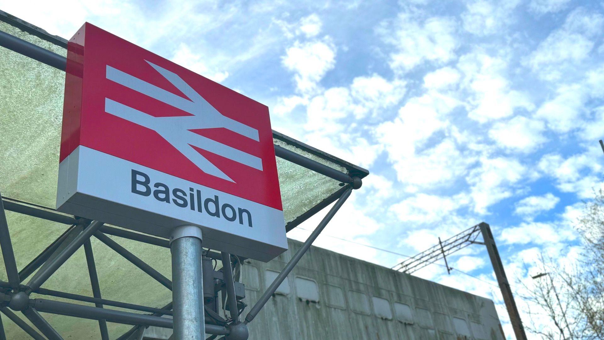 A train station sign saying "Basildon".