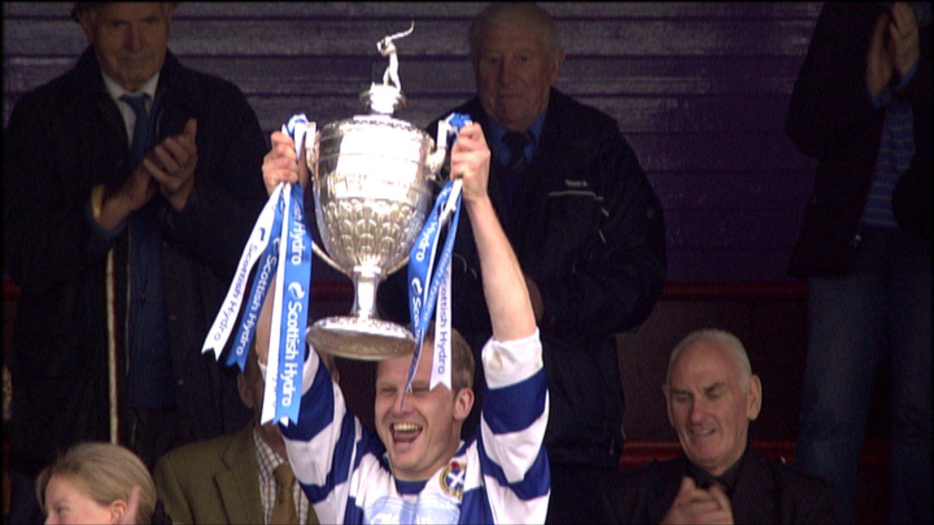 Newtonmore captain Scott Campbell with the Camanachd Cup