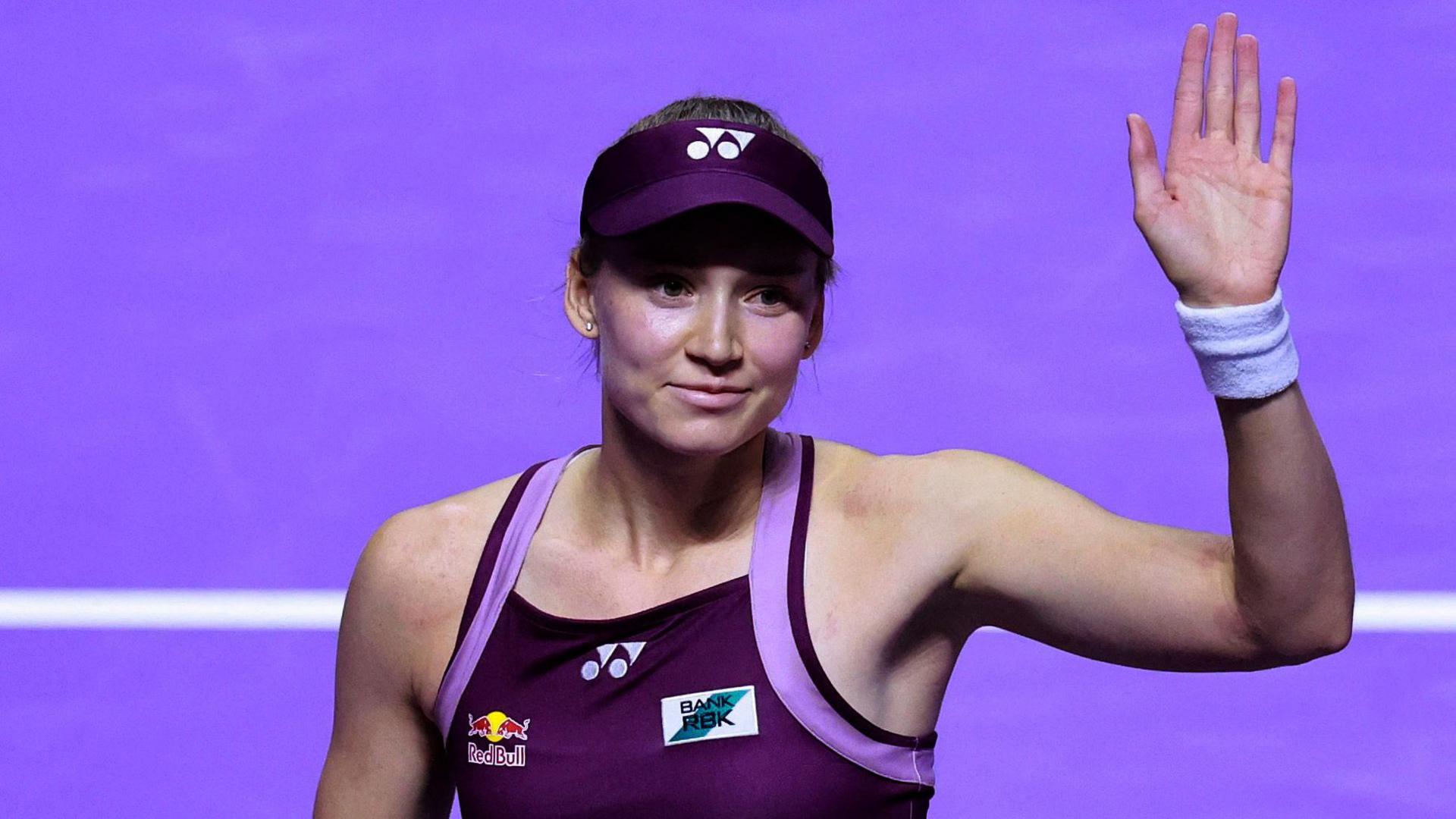 Elena Rybakina waves to the crowd after beating Amanda Anisimova