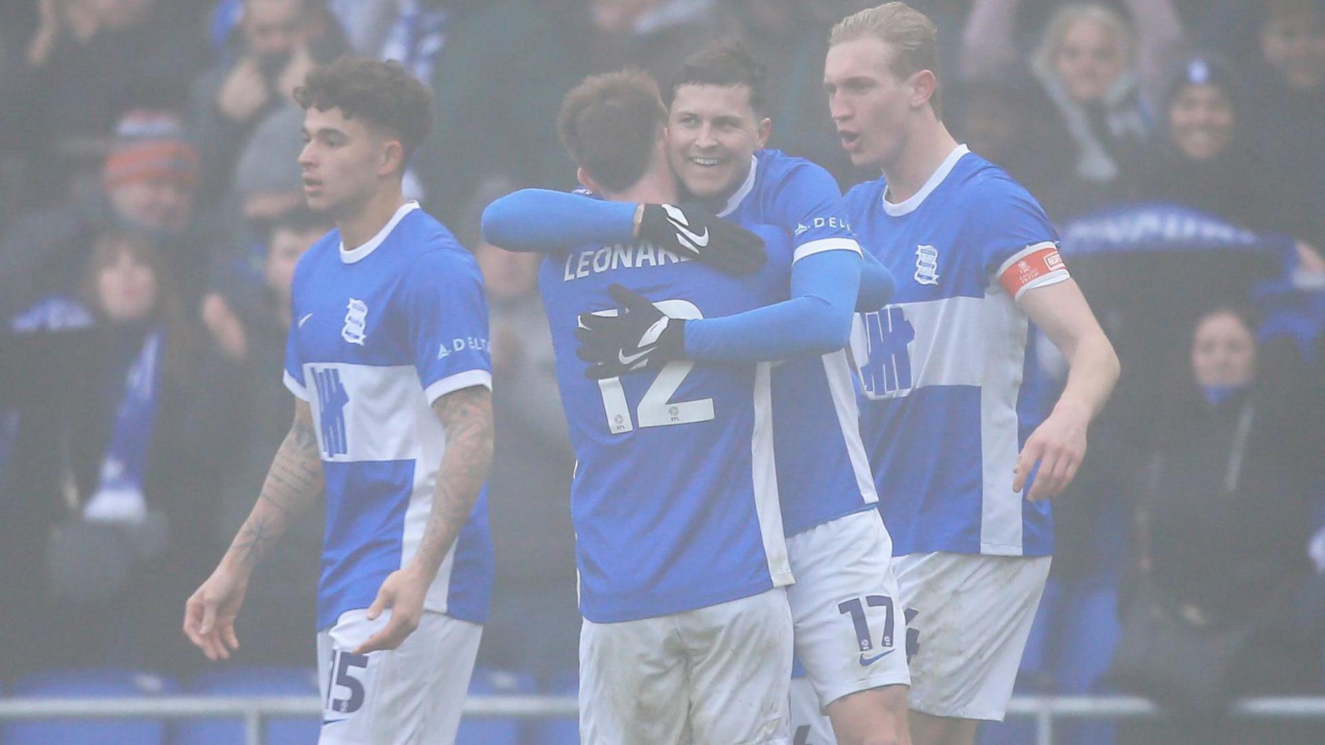 Lyndon Dykes celebrates his stunning goal at a foggy St Andrew's 