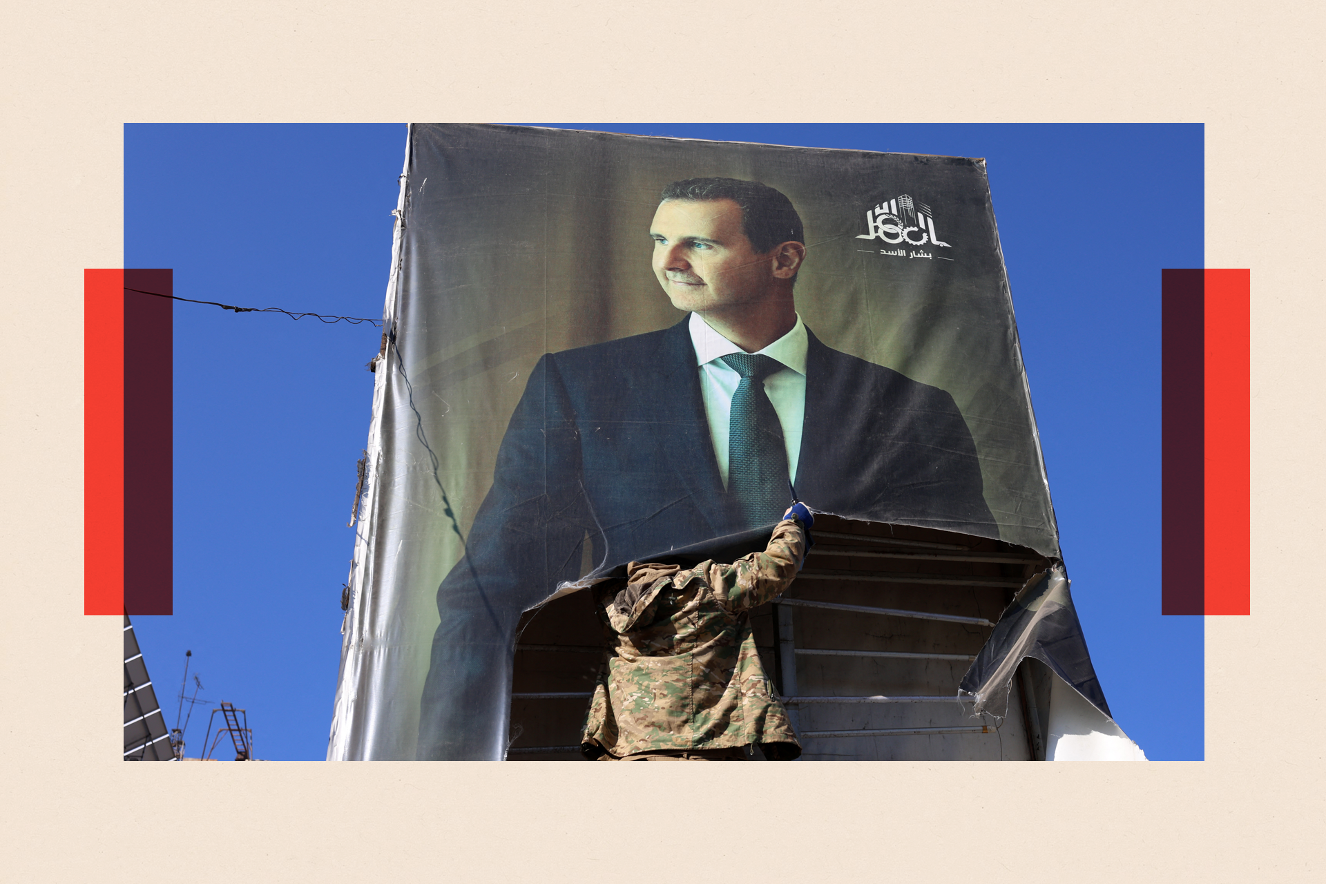 An anti-government fighter tears down a portrait of Syria's President Bashar al-Assad in Aleppo