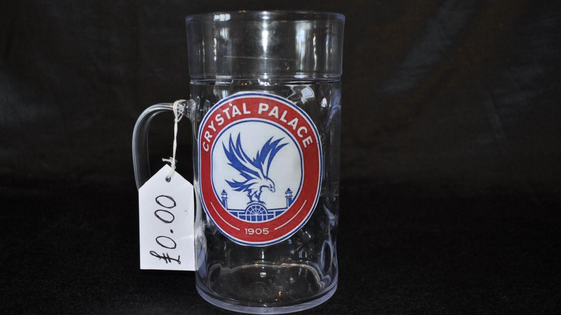 An empty Crystal Palace beer stein with a zero price tag
