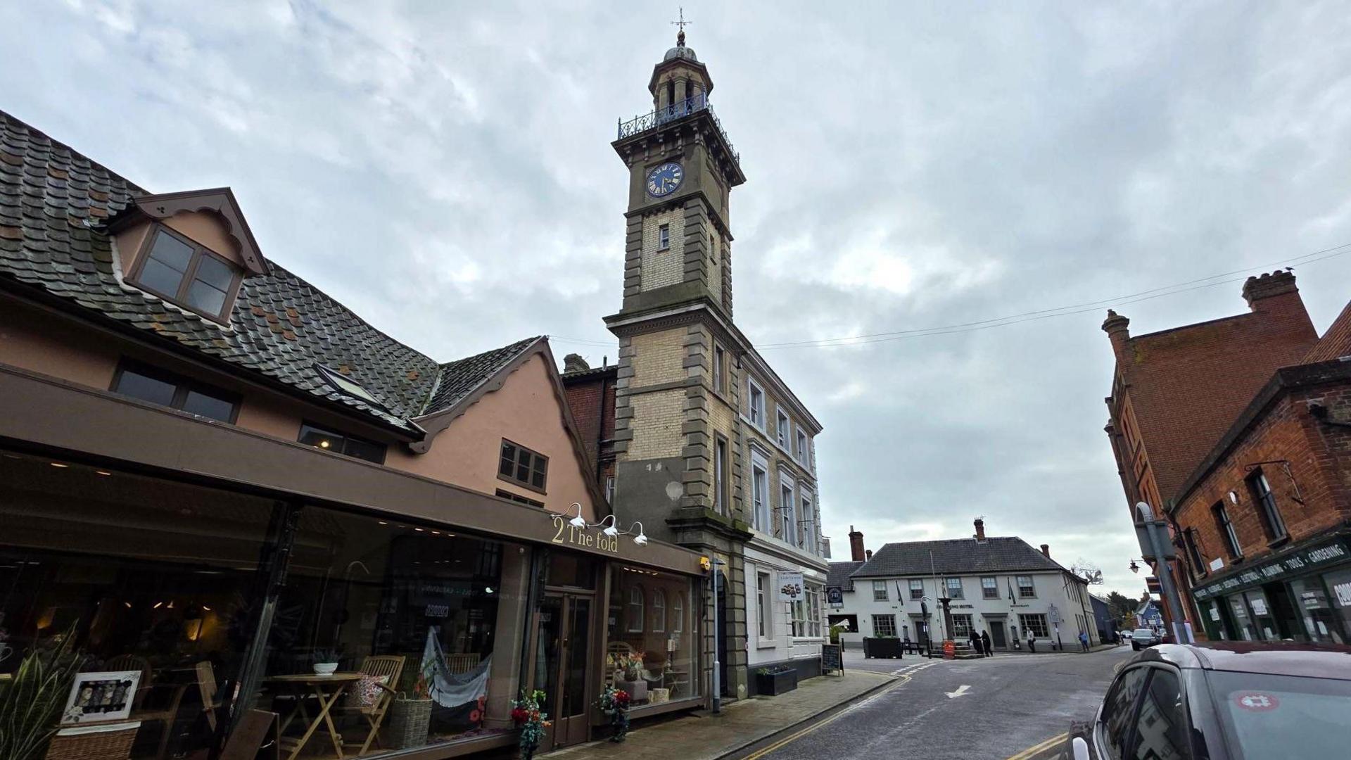Part of Harleston town centre, with a clock tower dominating the picture.