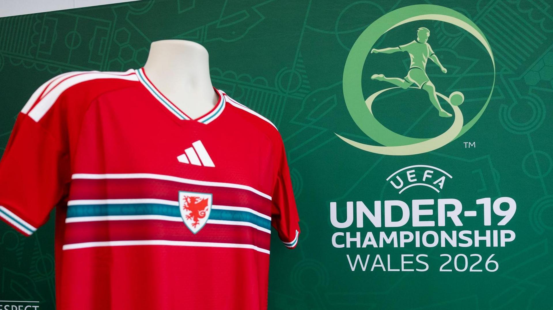 Wales shirt in front of Uefa Under-19s branding