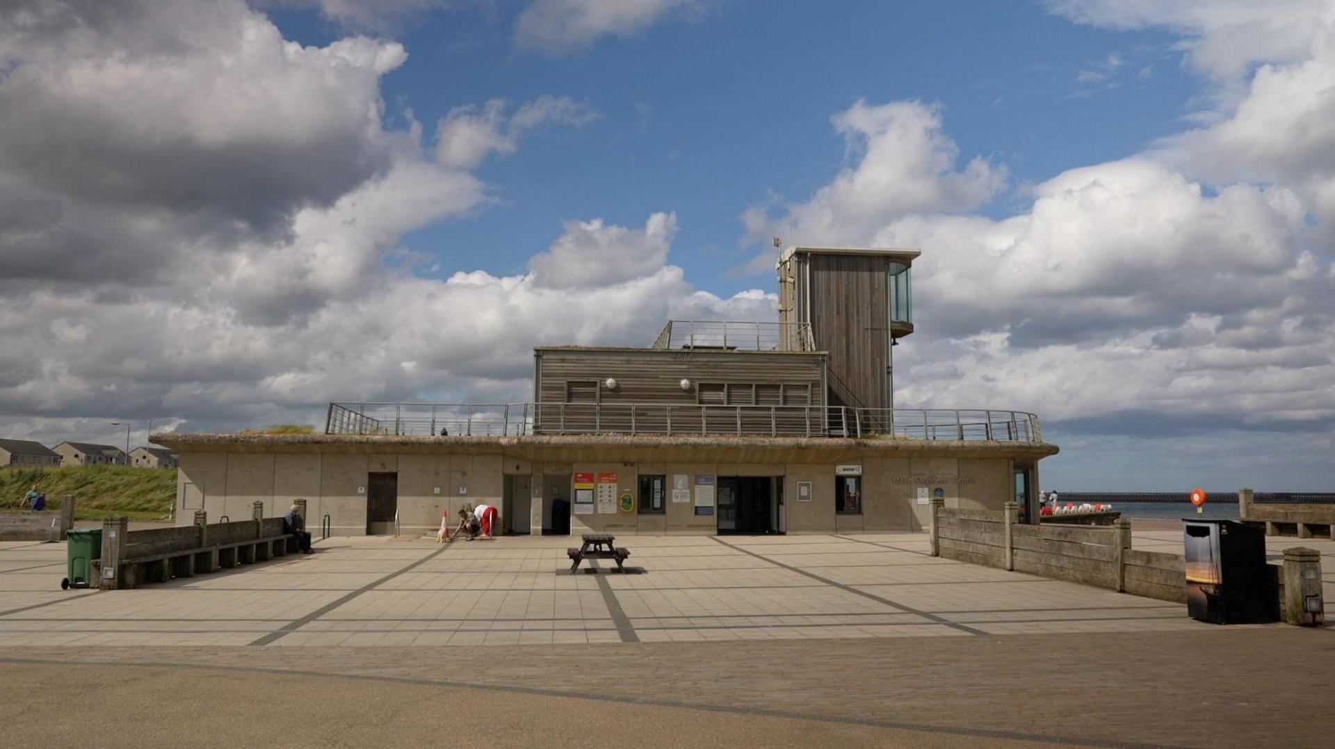 Dave Stephens Centre, a building near the beach that is made from wood and concrete 