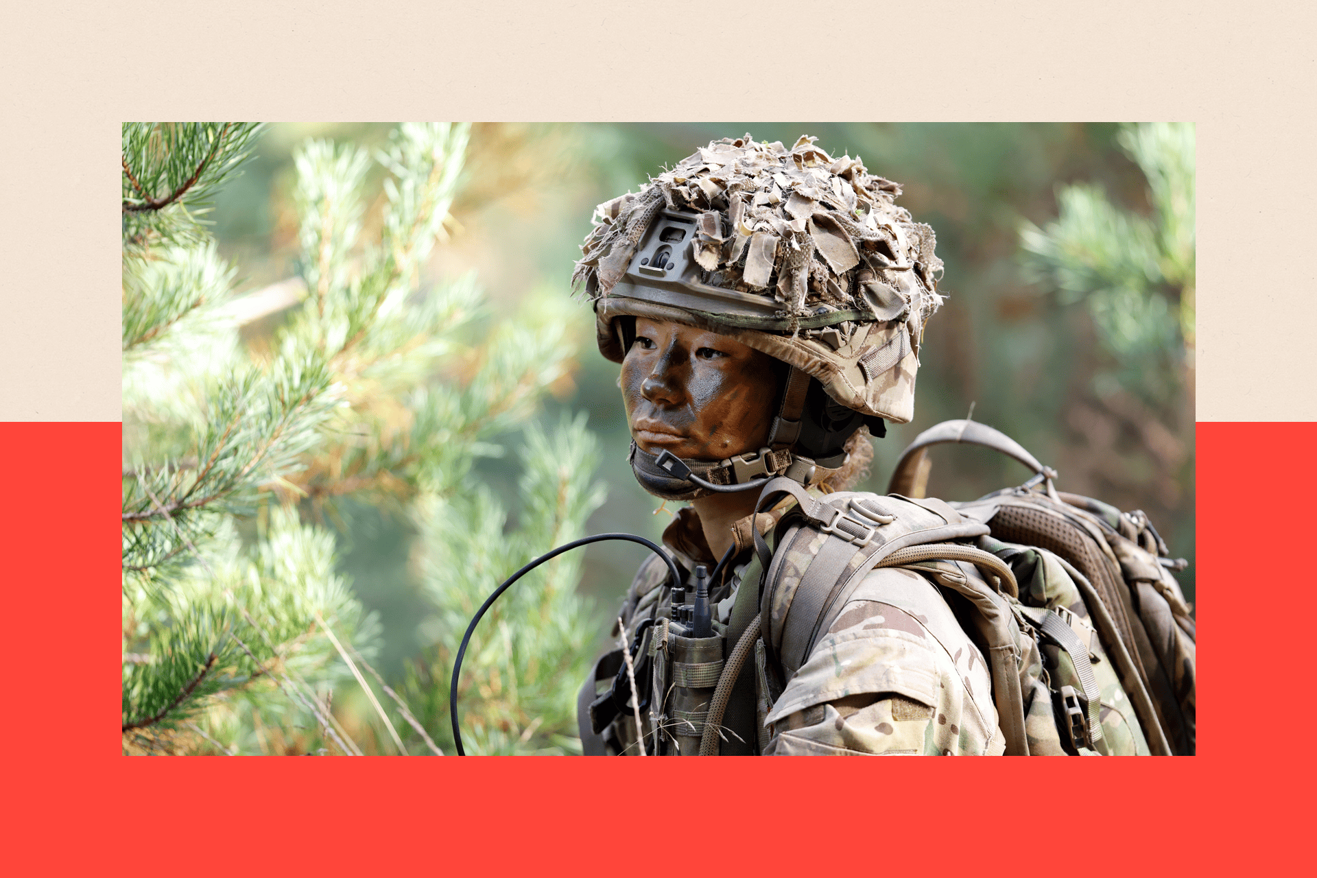 A female soldier of 1st Battalion London Guards takes part in a training exercise on Hankley Common