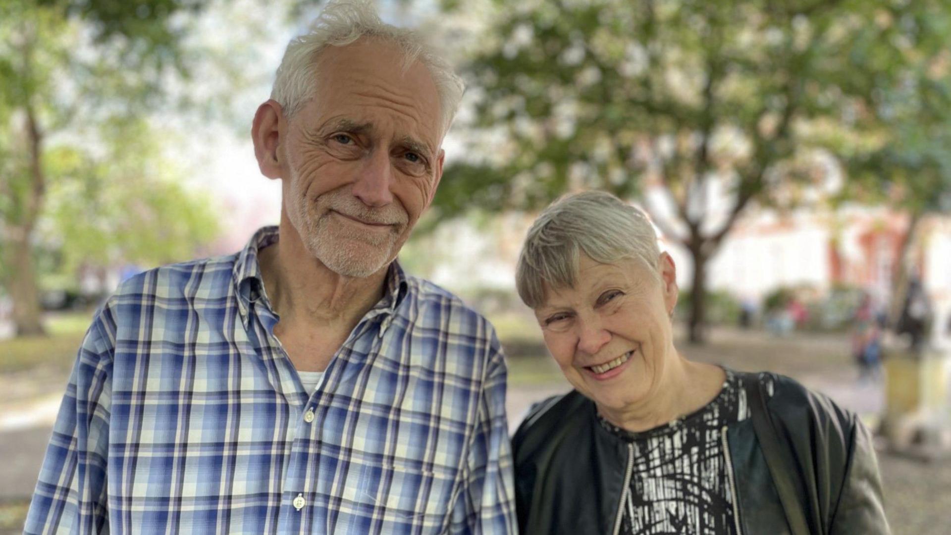 Steven Pidwill stands next to his wife Rachel Hawley, 72, who has Alzheimer's.
