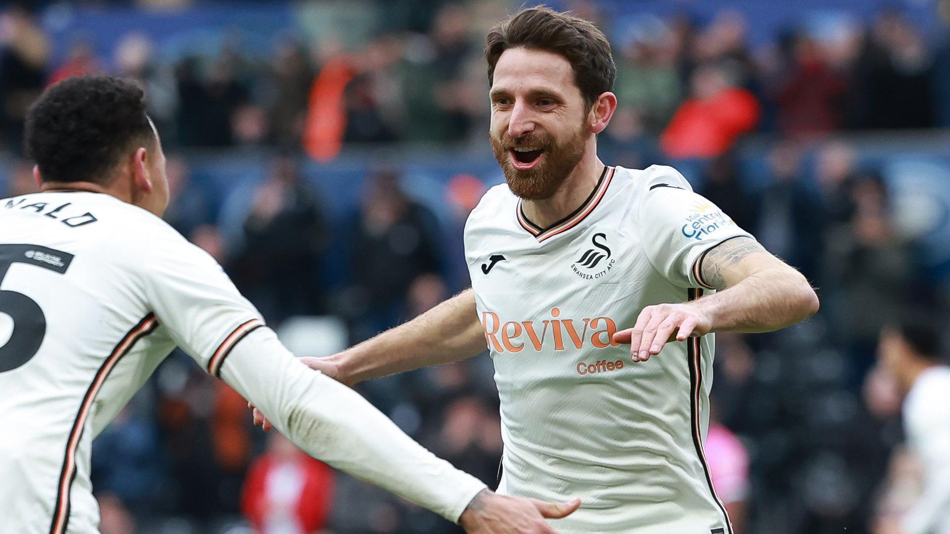 Joe Allen celebrates his goal