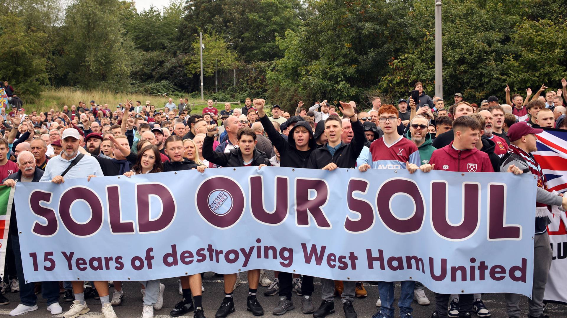 West Ham fans hold a banner with the words 'Sold our soul - 15 years of destroying West Ham United'