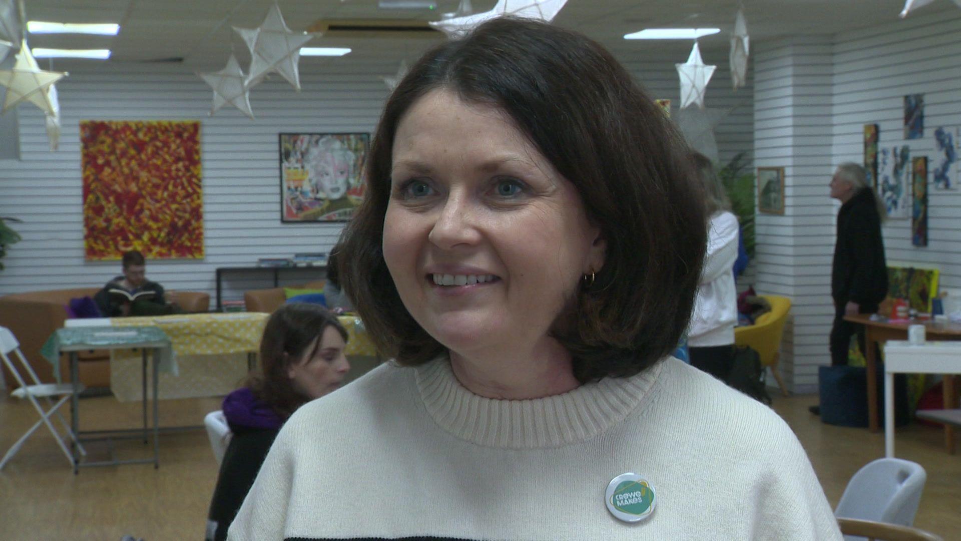 Novae Baghurst, the co-director of Crewe Creates which runs Crewe Makes, stands in the space, with dark bob-length hair, and is wearing a cream coloured sweater.