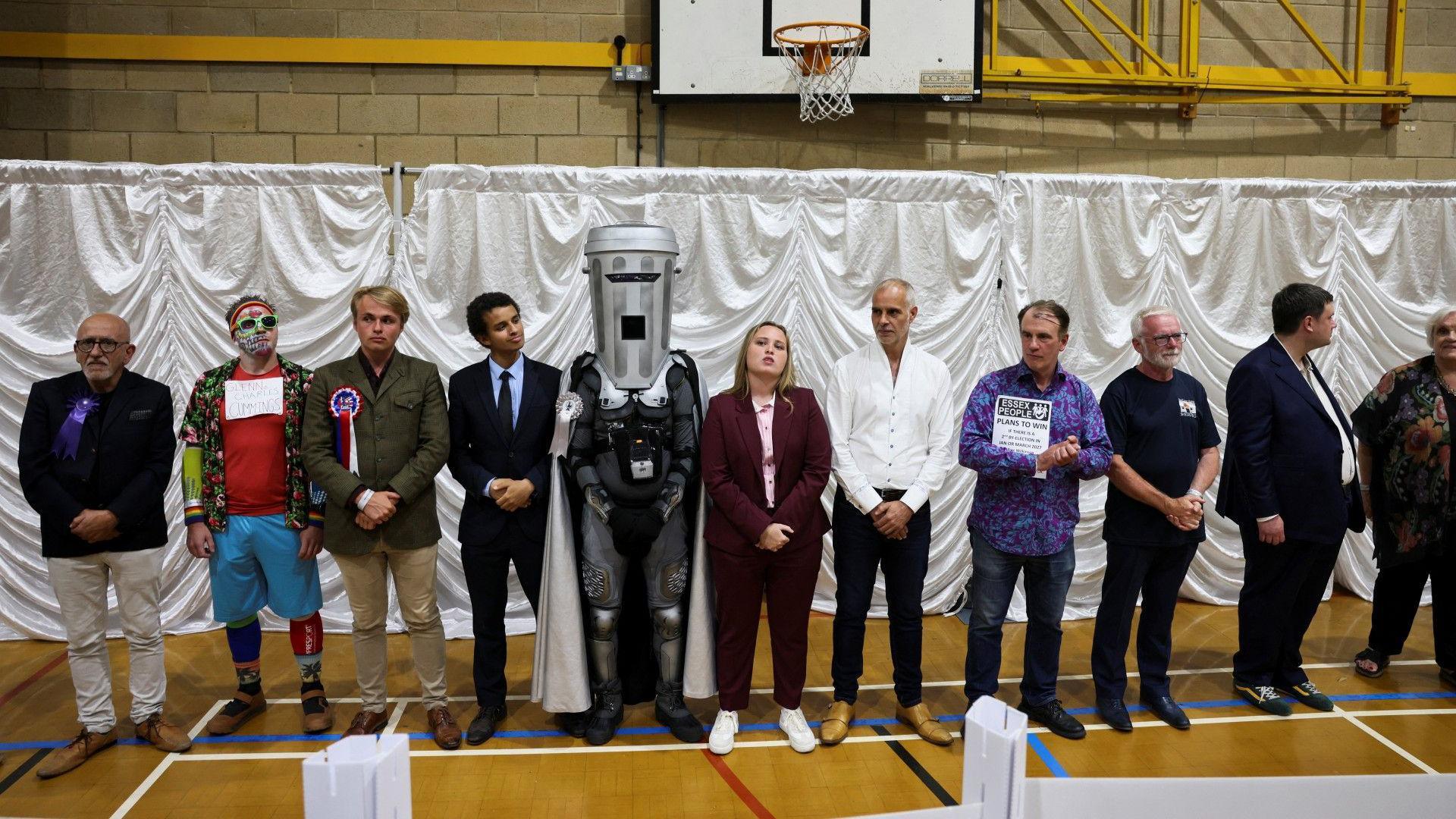 Count Binface stands with other candidates after Reform UK party leader Nigel Farage was declared the winner for the Clacton by-election.