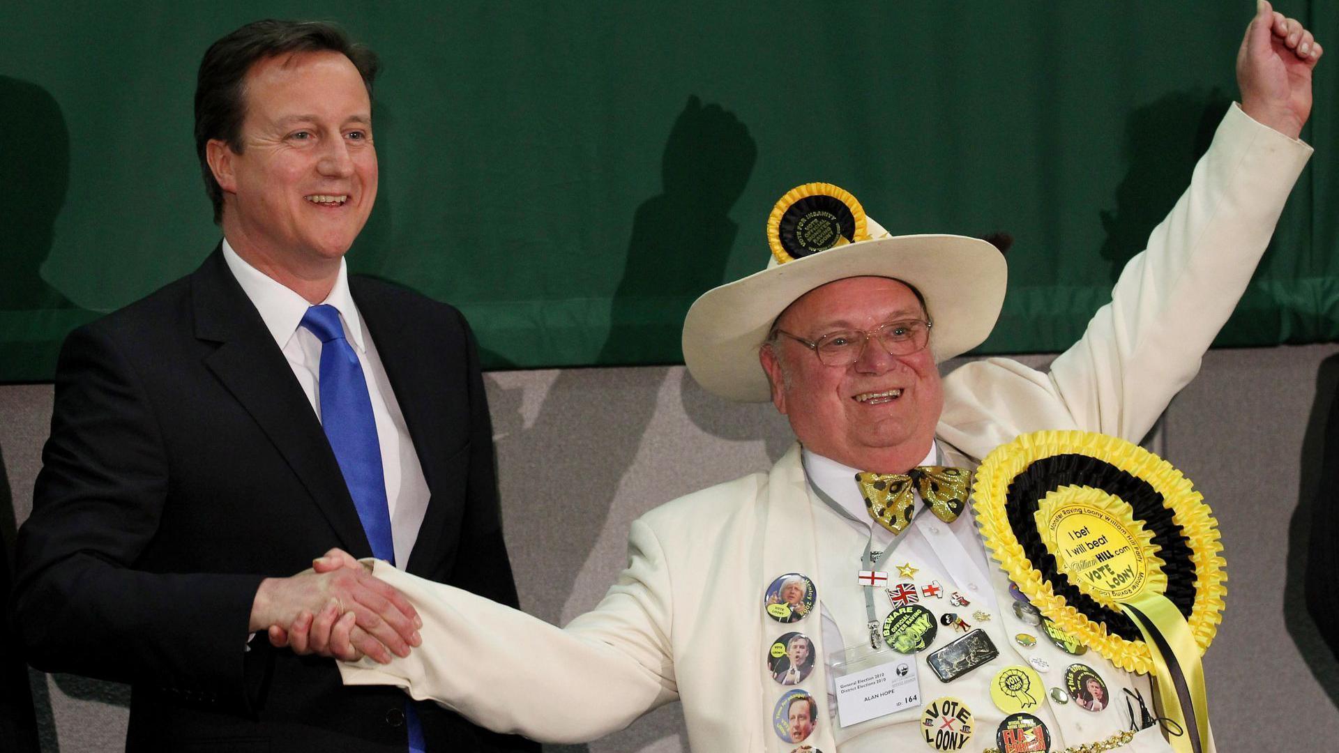 Then-prime minister David Cameron shaking hands with Alan "Howling Laud" Hope in 2010