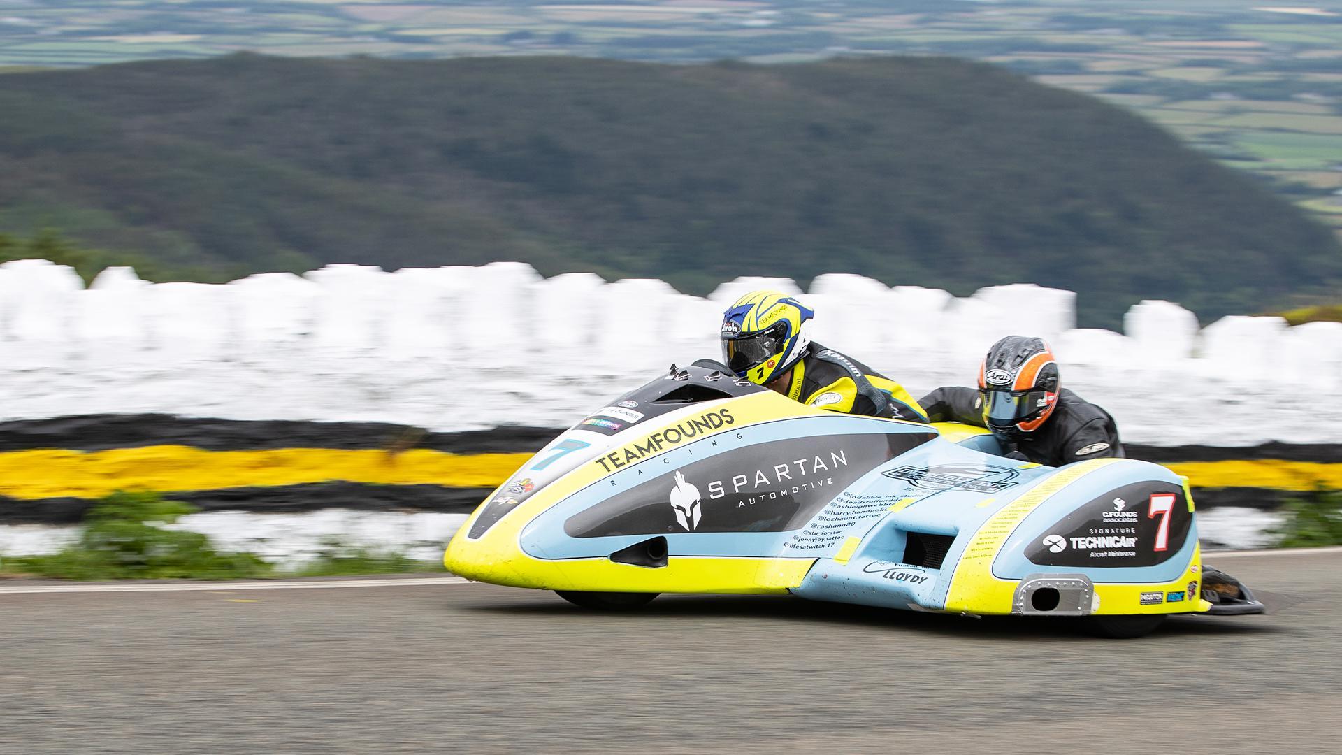 Alan Founds and Colin Smyth racing a sidecar