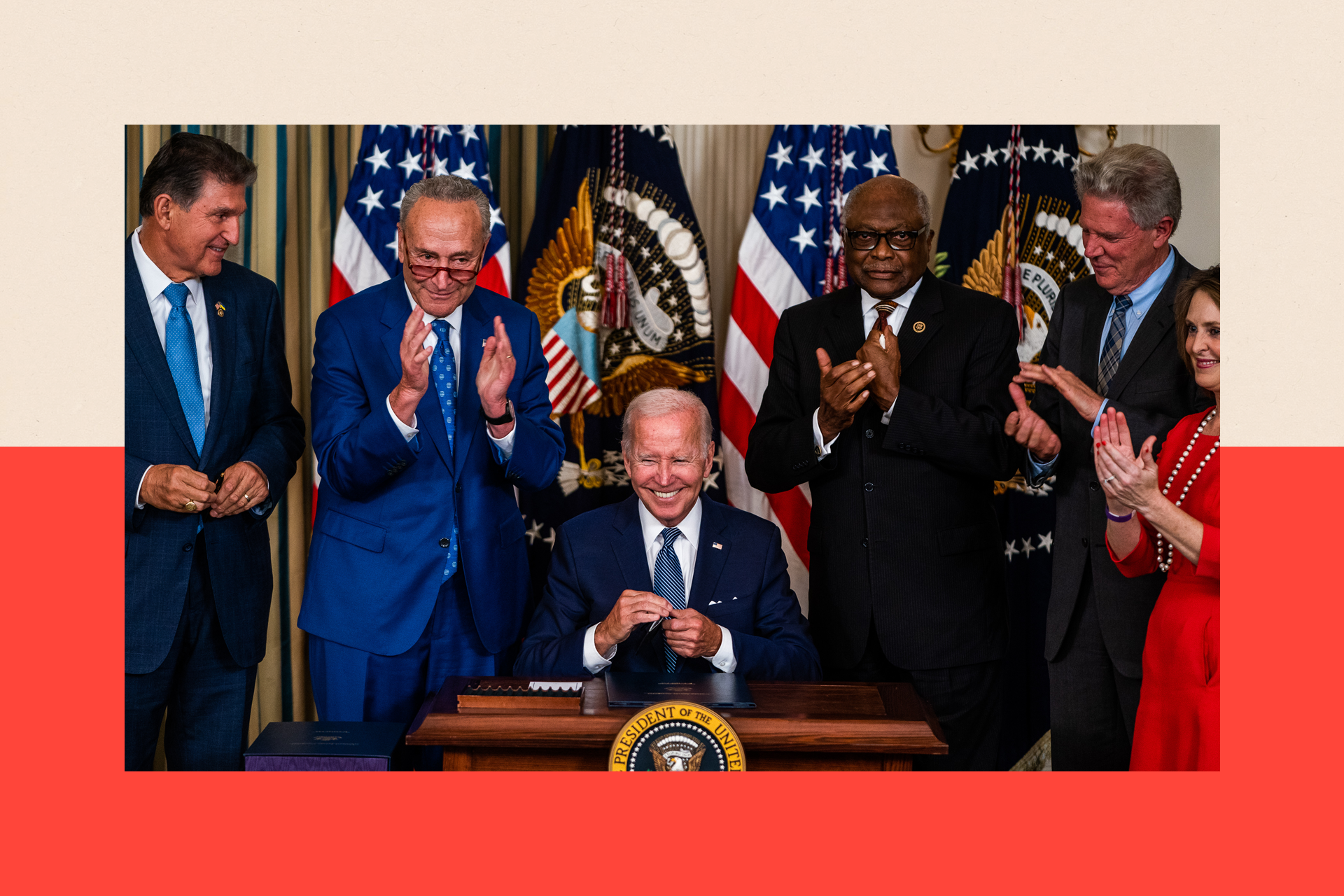 Biden smiling and surrounded by people 