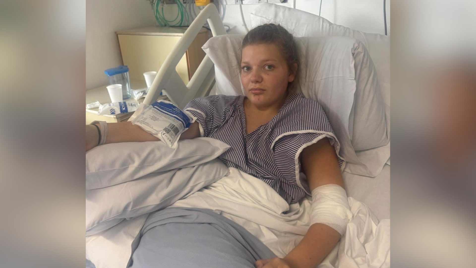 A young girl resting in a hospital bed. 