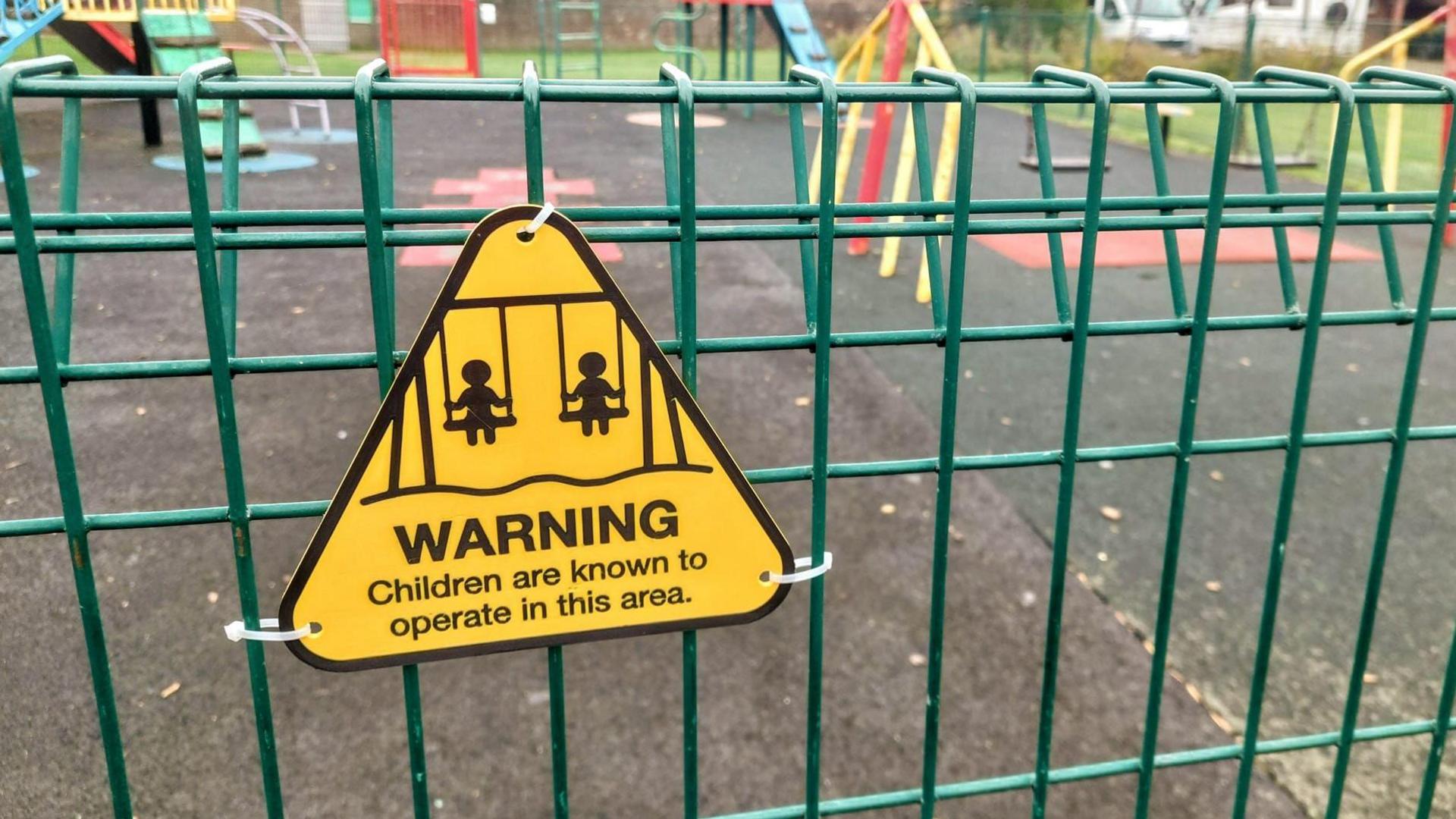 A comic sign reads: Warning! Children are known to operate in this area. 