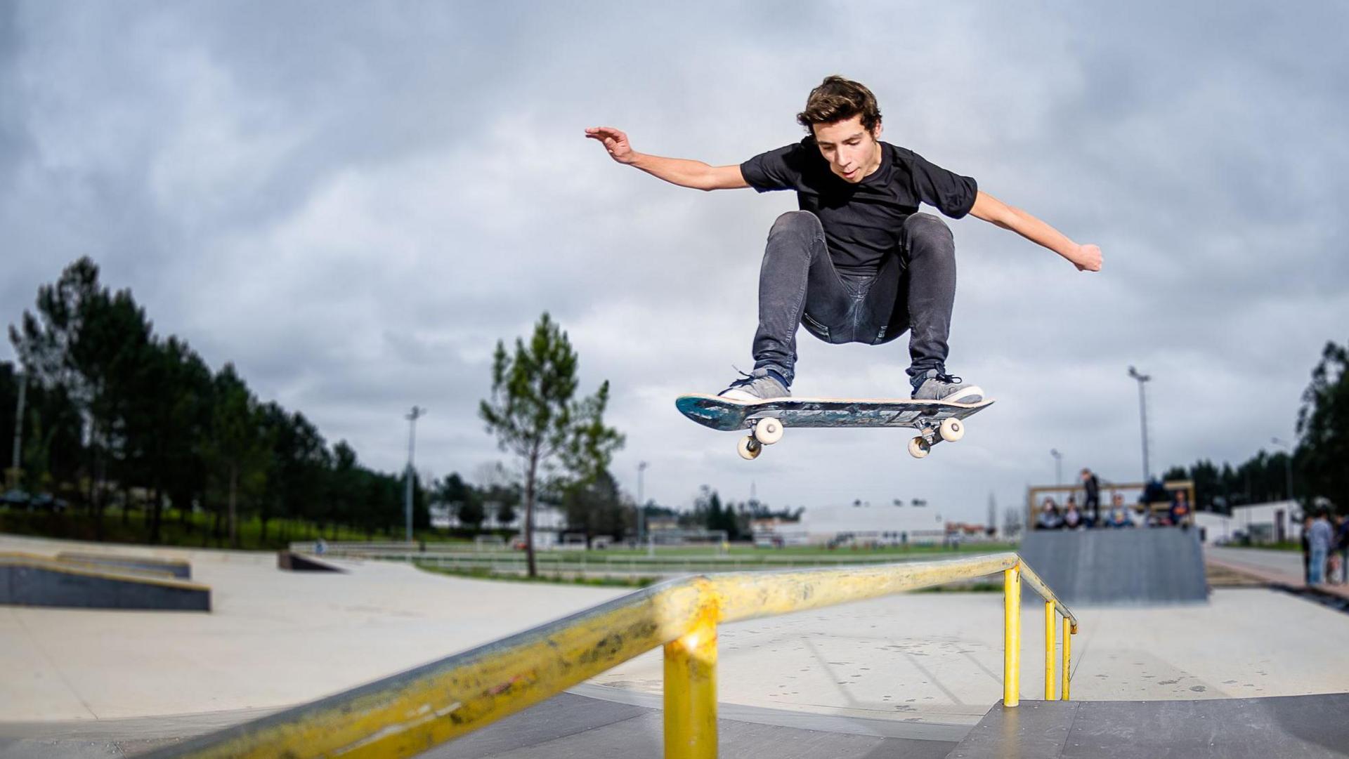 Young boy shows off skateboard skills.