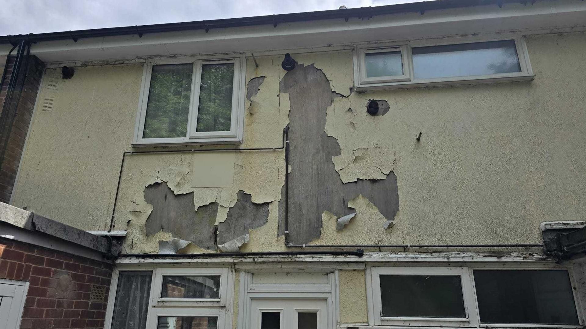 Render peeling from walls on the Eddleston Drive estate