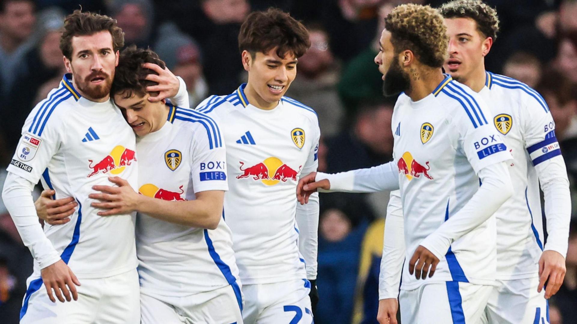 Leeds United players celebrate their opening goal in the game against Oxford United 