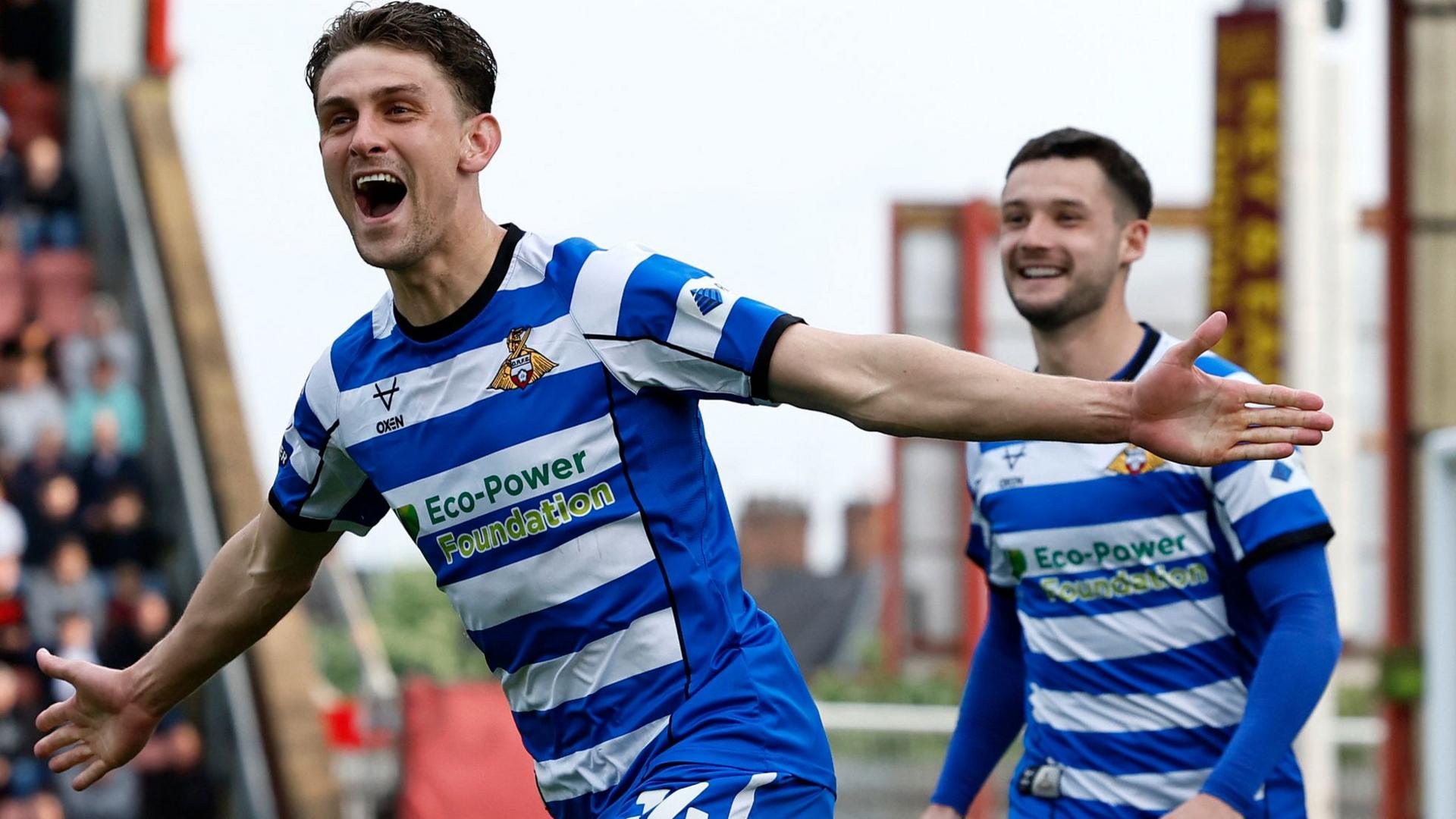 Doncaster Rovers' Harrison Biggins celebrates scoring 