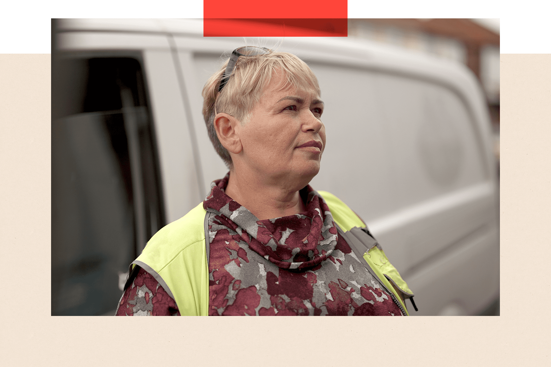 Irena, a woman with short blonde hair, stands in front of her delivery van