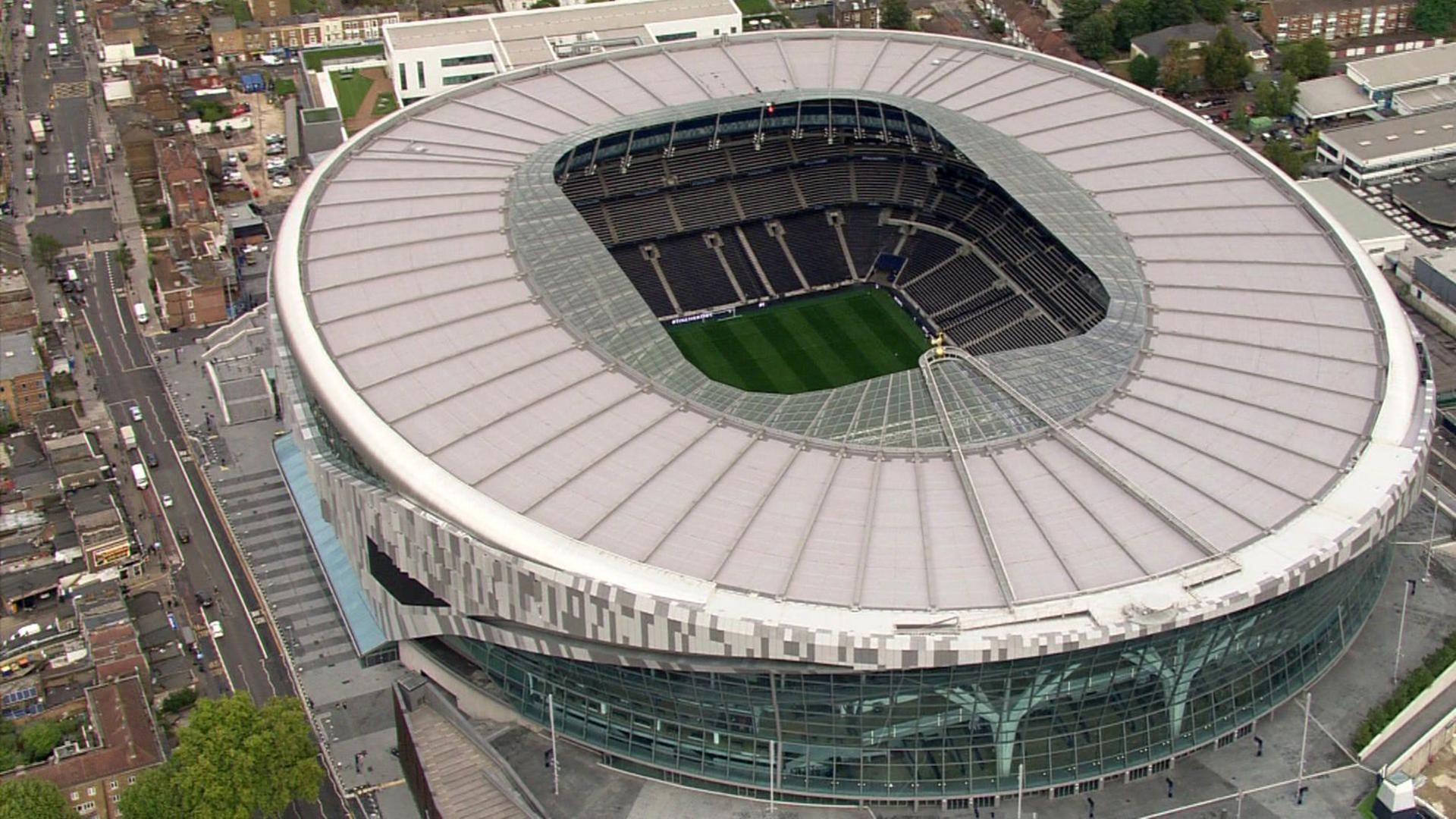 Aerial view of the new Tottenham Hotspur Stadium in north London, with houses and buildings in the background