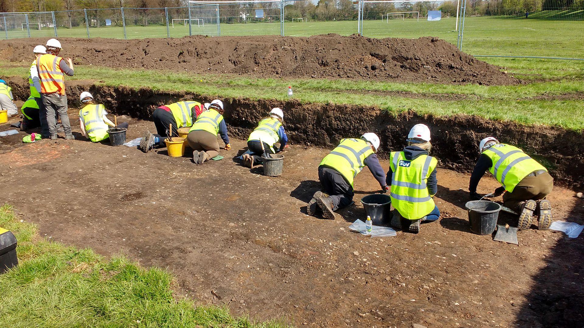Archaeologists digging at a site in Darley Playing Fields.